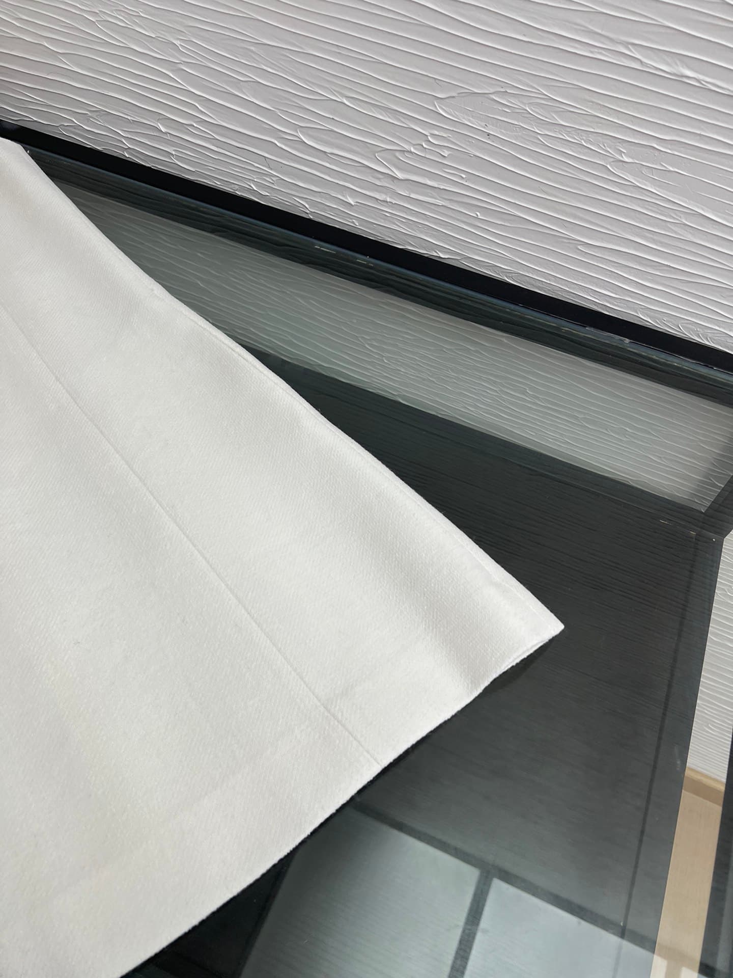 C18391 Image of the white dress laid flat — image 4