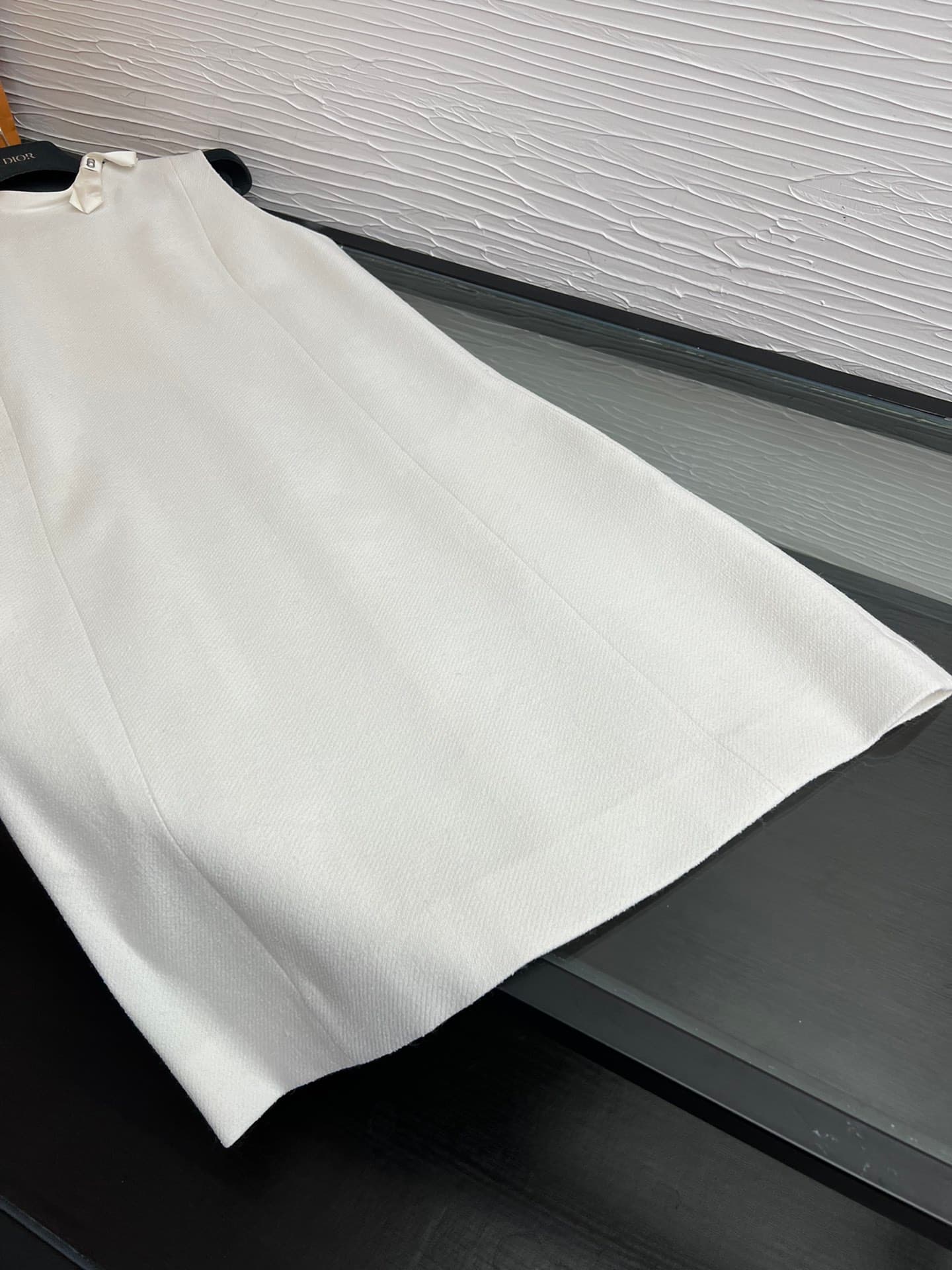 C18391 Image of the white dress laid flat — image 3