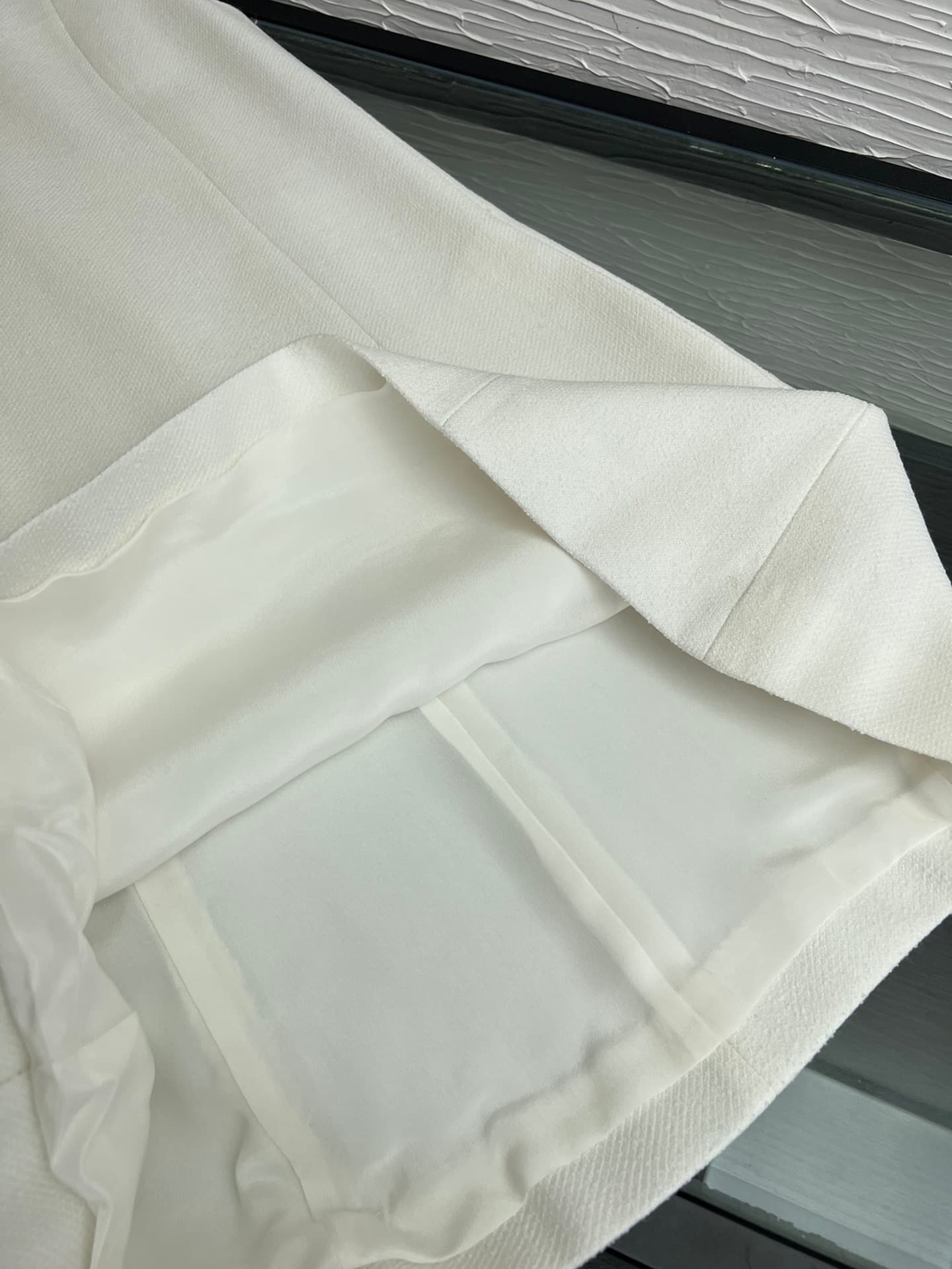 C18391 Image of the white dress laid flat — image 7