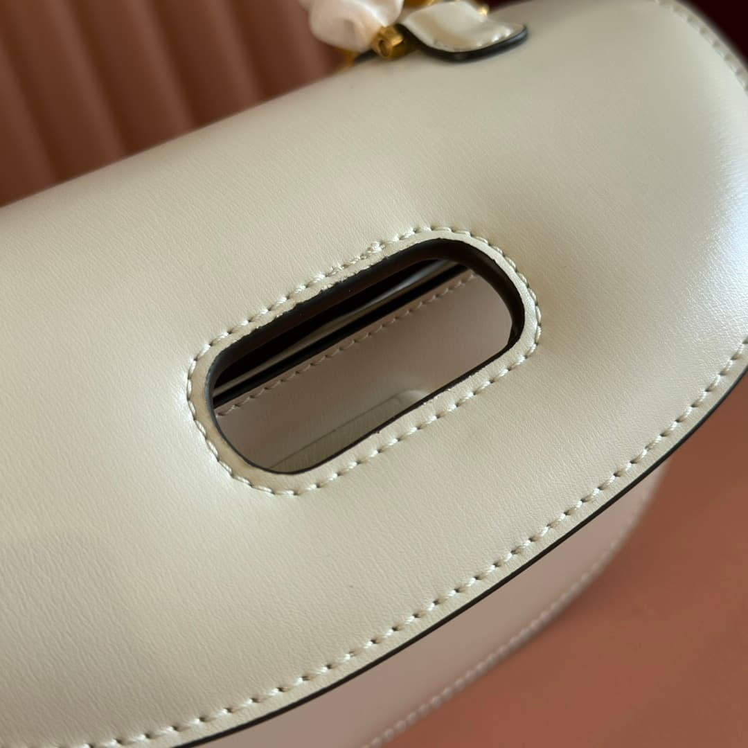 C4001 🔥🔥 The bamboo motifs symbolize Gucci’s enduring design heritage. The bamboo handles on this handbag are shaped through the heat of flames. This craftsmanship originated among Florentine artisans after World War II. The bag is made of green leather,  — image 7