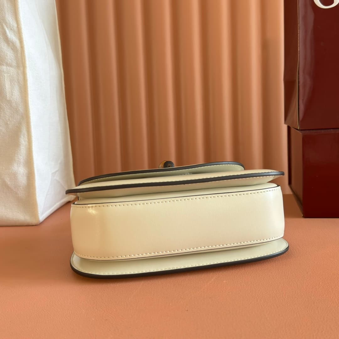C4001 🔥🔥 The bamboo motifs symbolize Gucci’s enduring design heritage. The bamboo handles on this handbag are shaped through the heat of flames. This craftsmanship originated among Florentine artisans after World War II. The bag is made of green leather,  — image 4