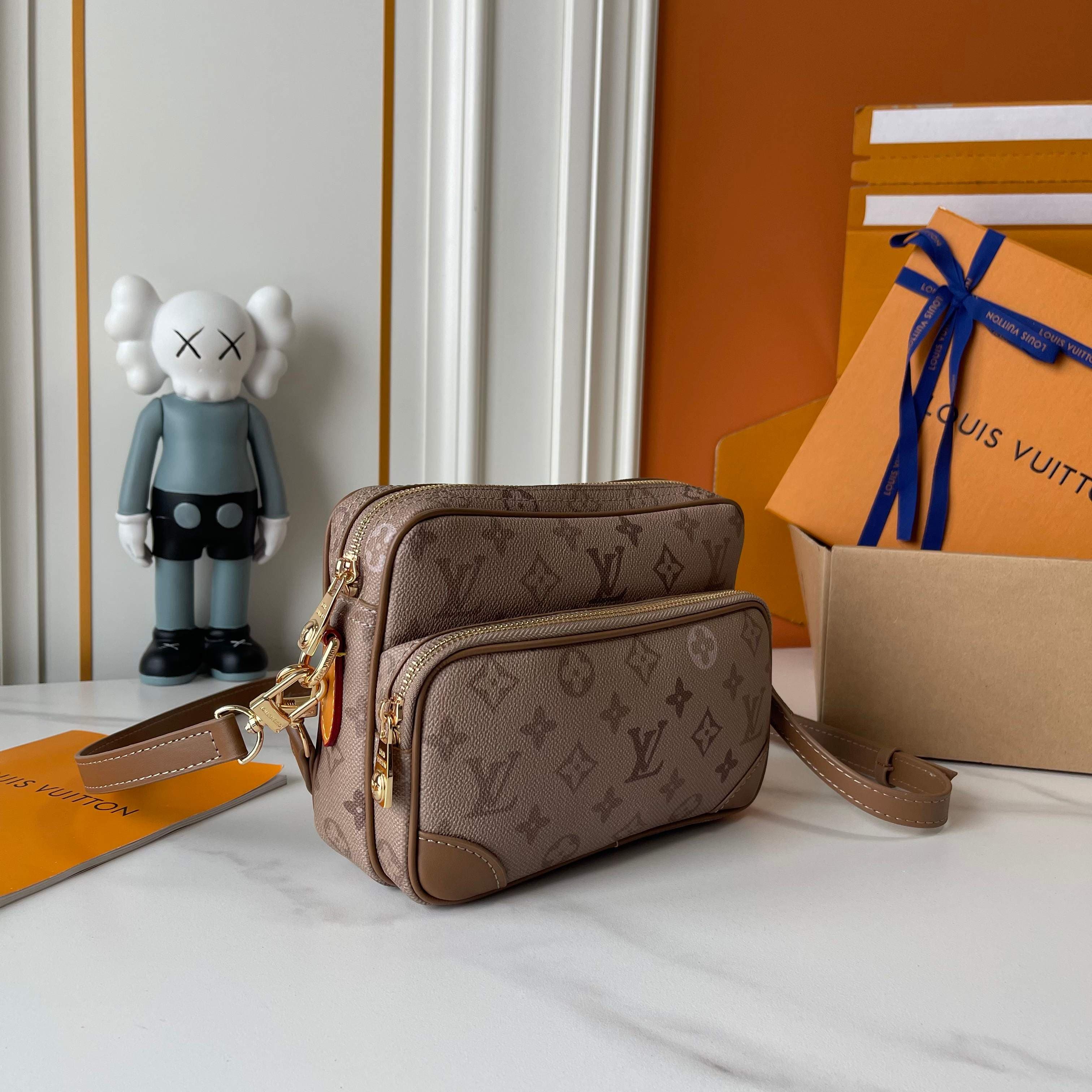 C5322 Upgraded version: M29273, M13987, M14016, M14988, M26068, M15296, M14682, M27232, n28606. This Nil handbag features elegant, shiny cowhide leather; beads and rivets are used to secure the Louis Vuitton Paris logo on the front. The side fastenings re — image 2
