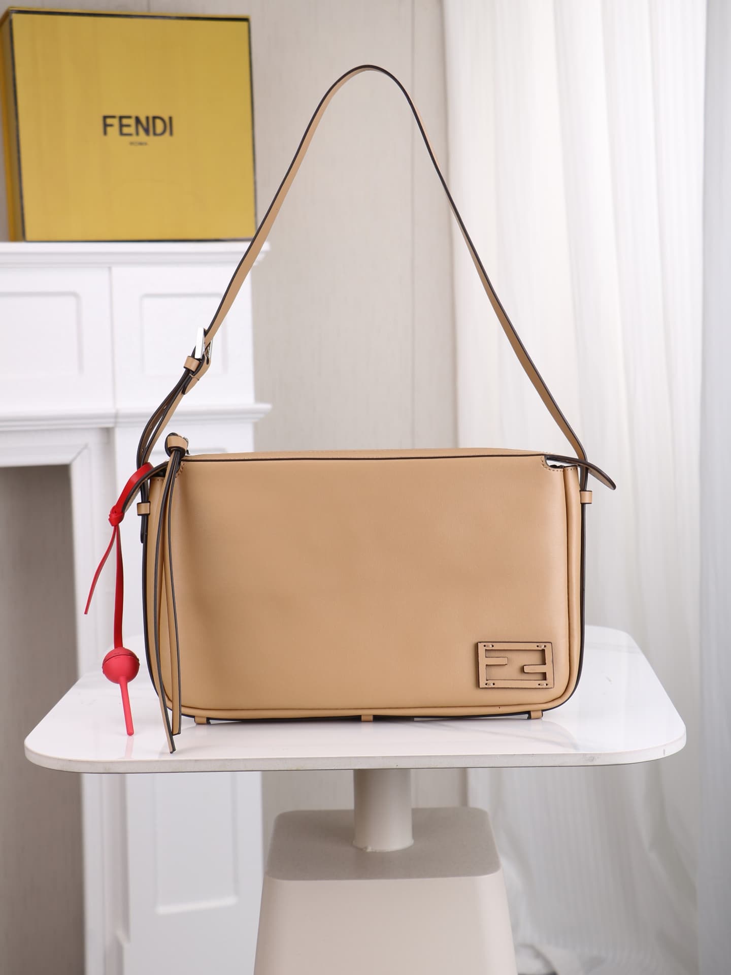 C2871 The medium-sized 4409 Simply FENDI handbag is a soft crossbody bag that appeared at the autumn and winter fashion shows. It draws its inspiration from the classic design of 20 and 90 from the early years of that era; it was named after its elegant,  — image 1