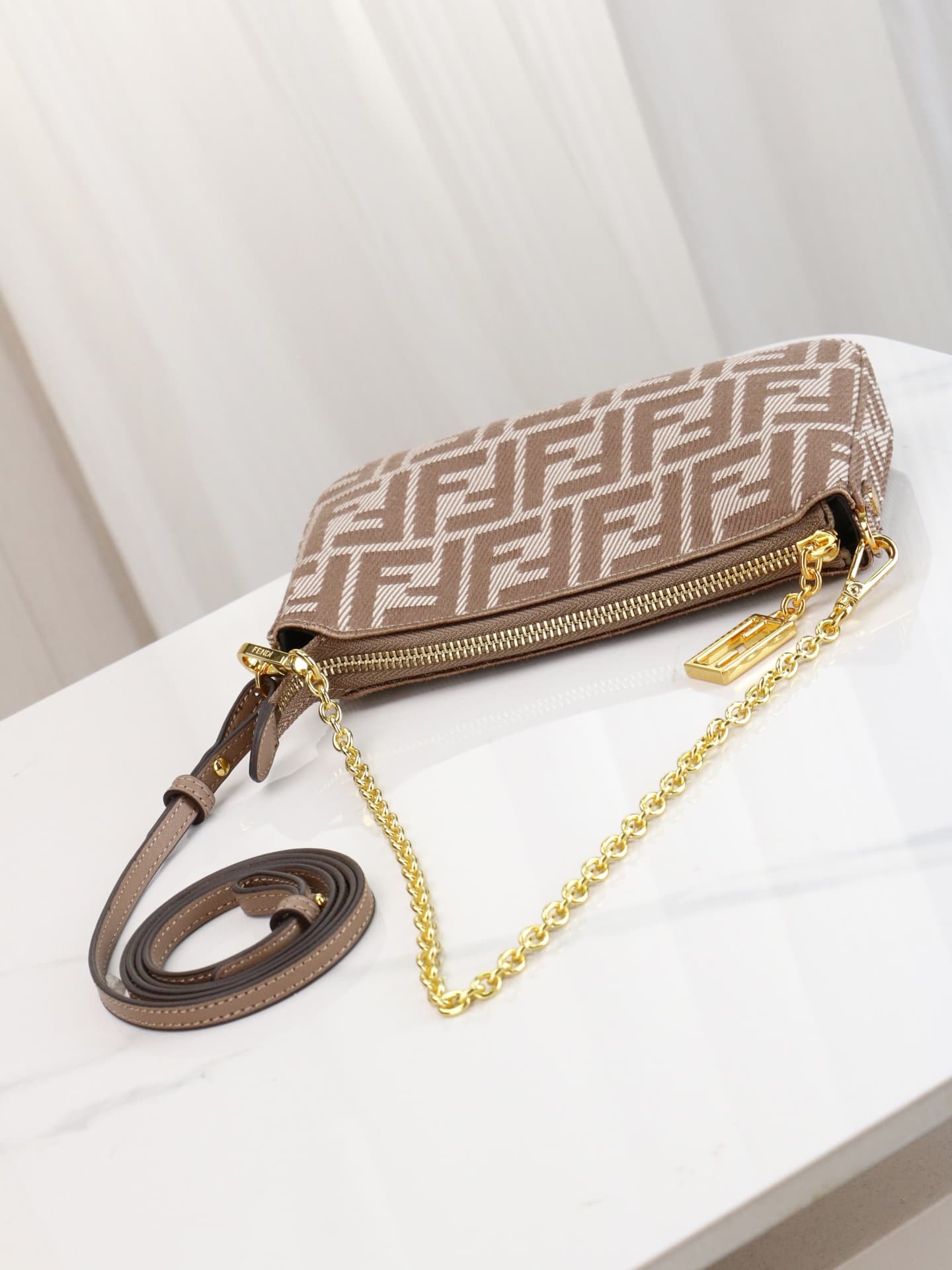 C2861 Model 7717 Baguette handbag. Made of denim print material, with classic double F logos. Features a detachable thin chain and long shoulder strap. Closes with zippers; the zipper pulls have the distinctive FF pattern. It’s small and delicate, perfect — image 7