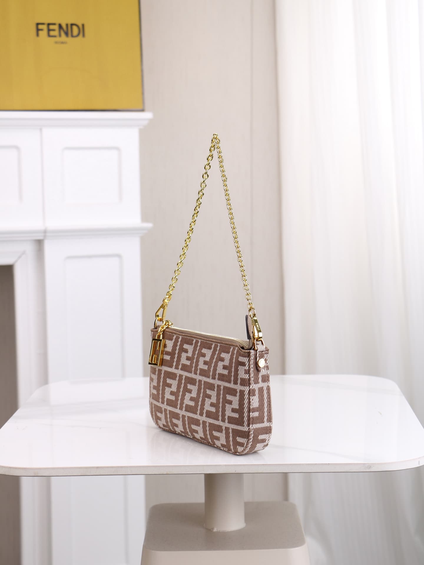 C2861 Model 7717 Baguette handbag. Made of denim print material, with classic double F logos. Features a detachable thin chain and long shoulder strap. Closes with zippers; the zipper pulls have the distinctive FF pattern. It’s small and delicate, perfect — image 2