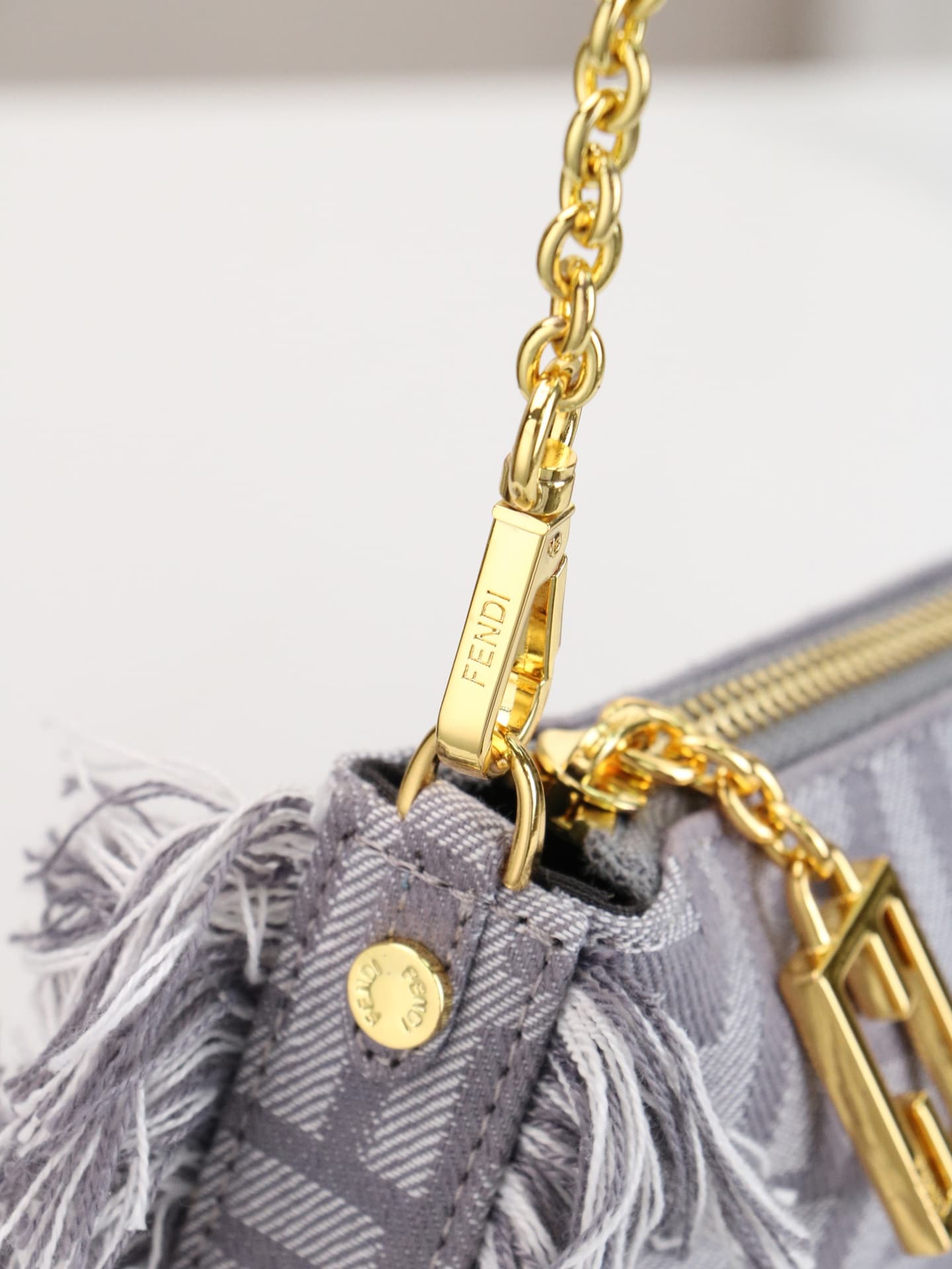 C2860 Model 7717 Baguette handbag. Made of denim print material, with classic double F logos. Features detachable thin chains and long shoulder straps. Closes with zippers, and the zipper pulls have the distinctive FF pattern. It’s compact and elegant; pe — image 4
