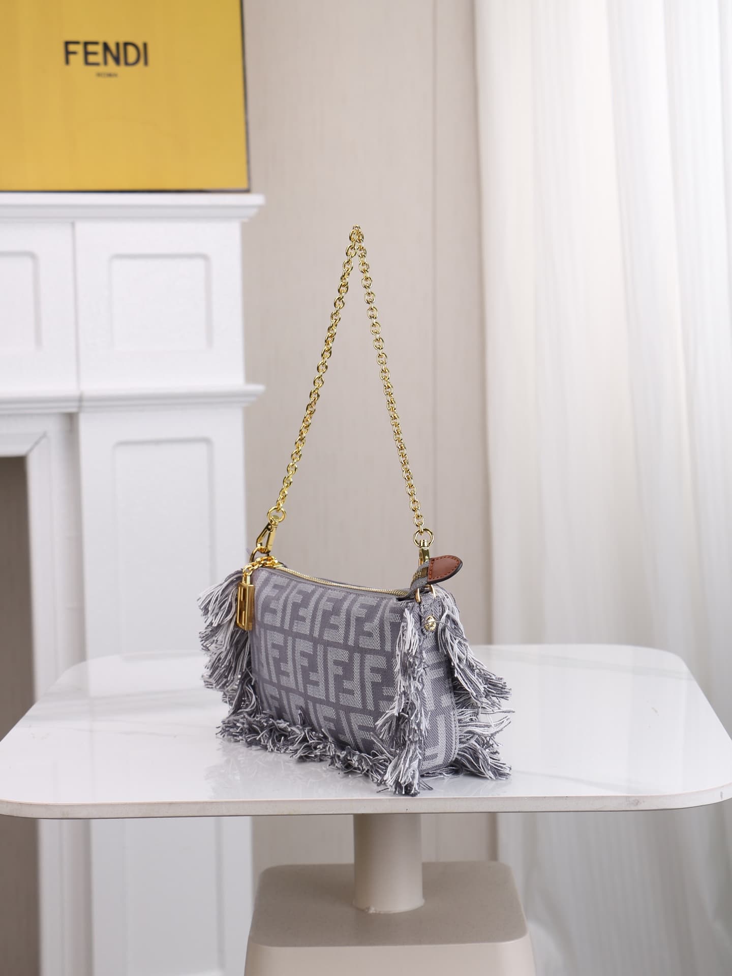 C2860 Model 7717 Baguette handbag. Made of denim print material, with classic double F logos. Features detachable thin chains and long shoulder straps. Closes with zippers, and the zipper pulls have the distinctive FF pattern. It’s compact and elegant; pe — image 2