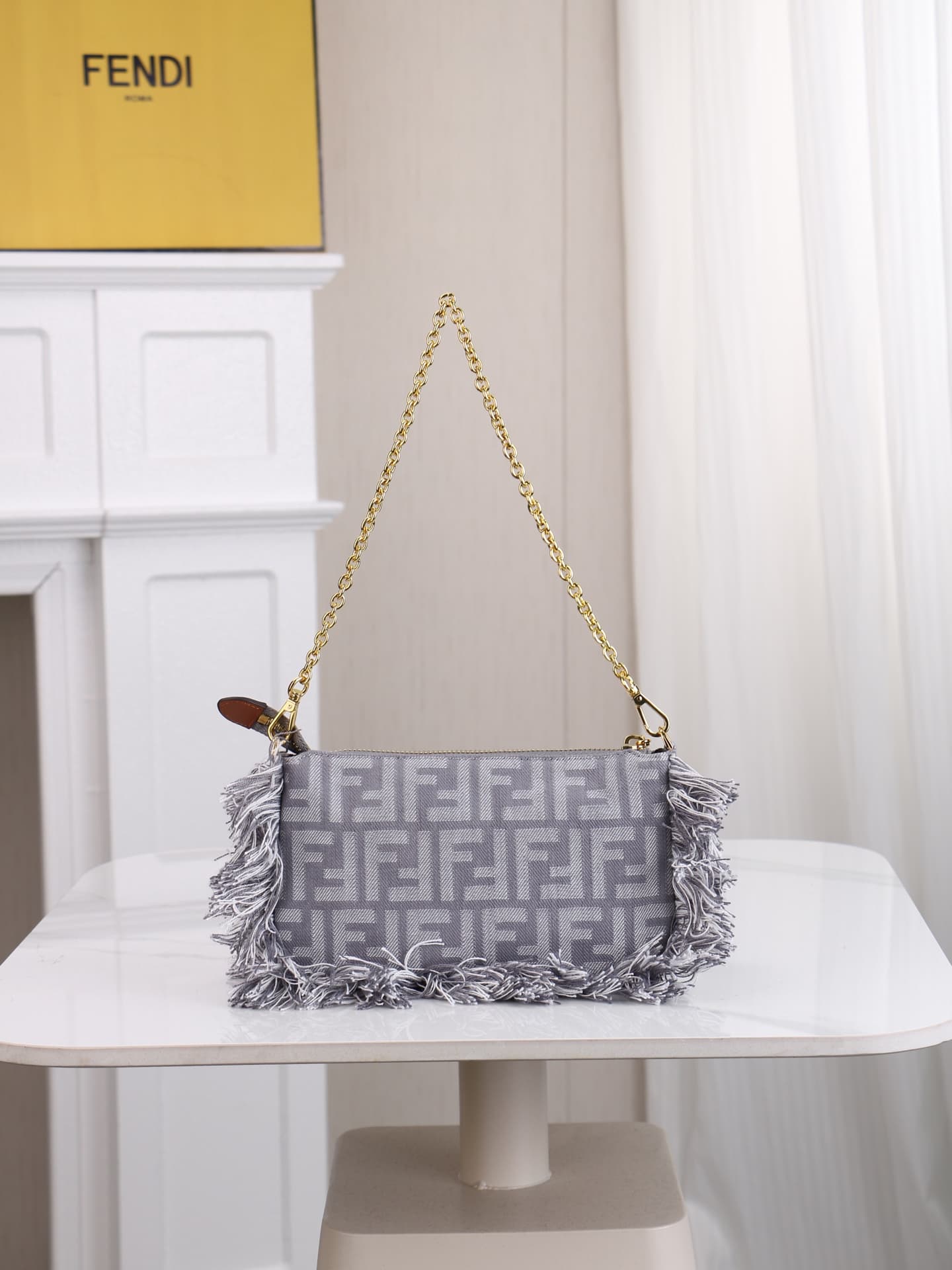 C2860 Model 7717 Baguette handbag. Made of denim print material, with classic double F logos. Features detachable thin chains and long shoulder straps. Closes with zippers, and the zipper pulls have the distinctive FF pattern. It’s compact and elegant; pe — image 3