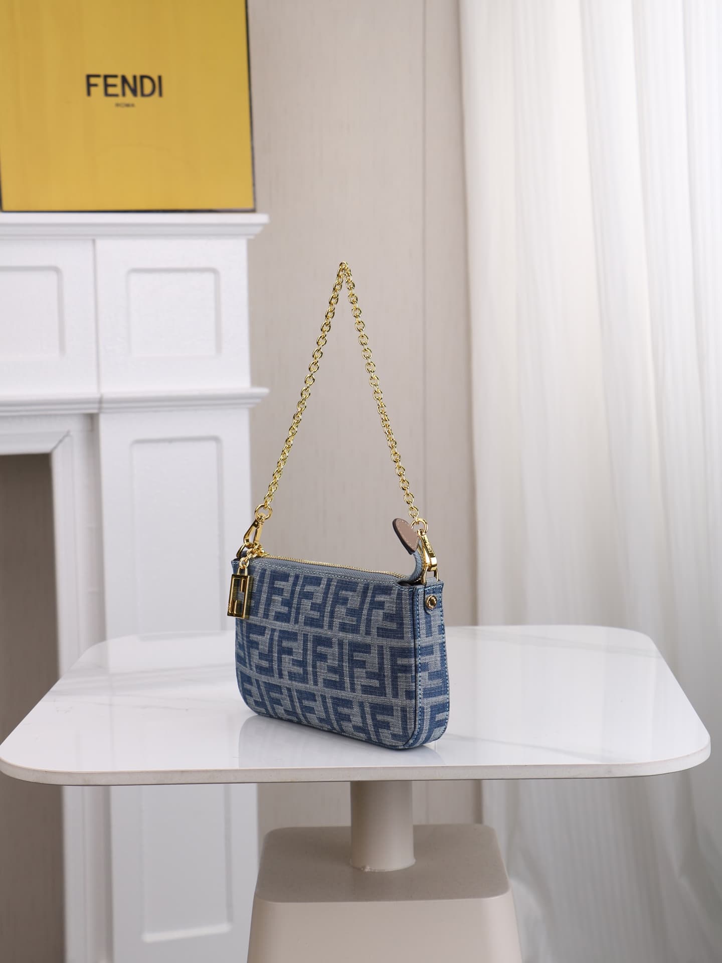 C2859 Model 7717 Baguette handbag. Made of denim print material, with classic double F logos. Features detachable thin chains and long shoulder straps. Opened with zippers, and the zipper pulls have the distinctive FF pattern. It’s compact and elegant; pe — image 2