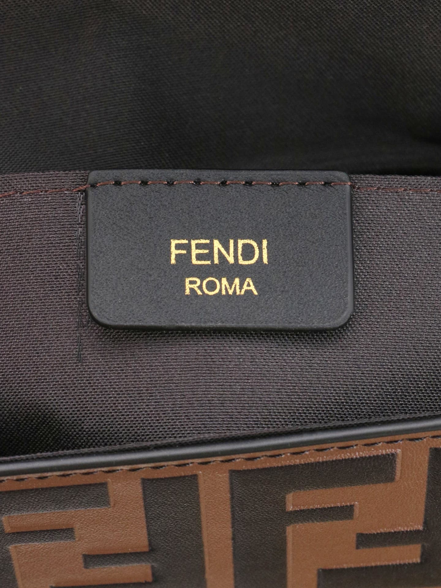 C2869 Fendi mini handbag with geometric pattern flap, equipped with a zipper closure.可拆卸 chain strap. Interior has flat pockets. The bag’s exterior is made of iconic brown leather with black raised FF print; it includes two detachable inner pockets – one  — image 8