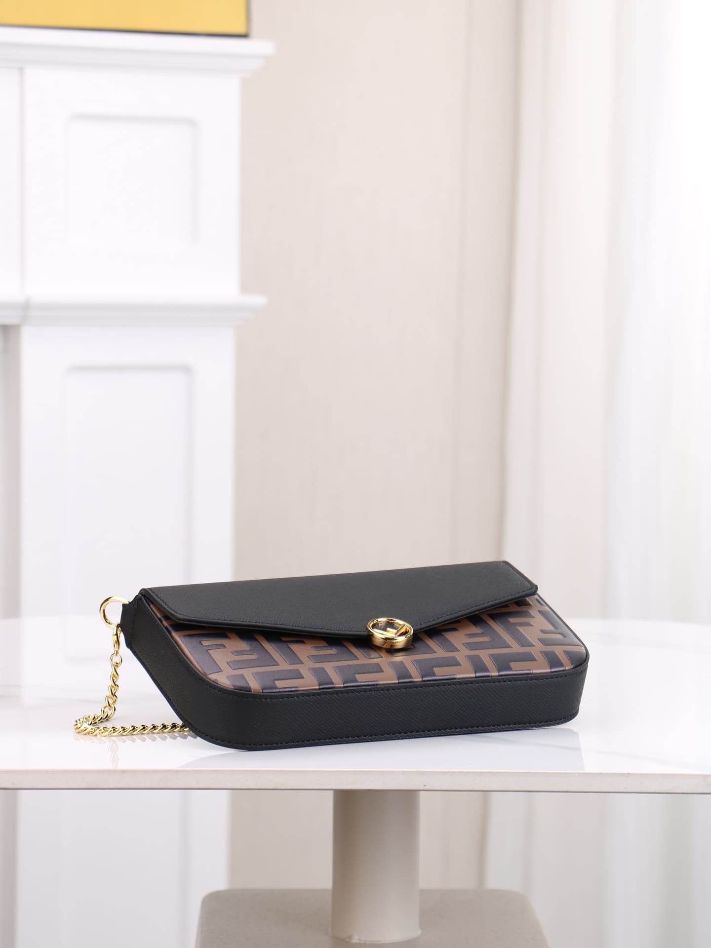 C2869 Fendi mini handbag with geometric pattern flap, equipped with a zipper closure.可拆卸 chain strap. Interior has flat pockets. The bag’s exterior is made of iconic brown leather with black raised FF print; it includes two detachable inner pockets – one  — image 4