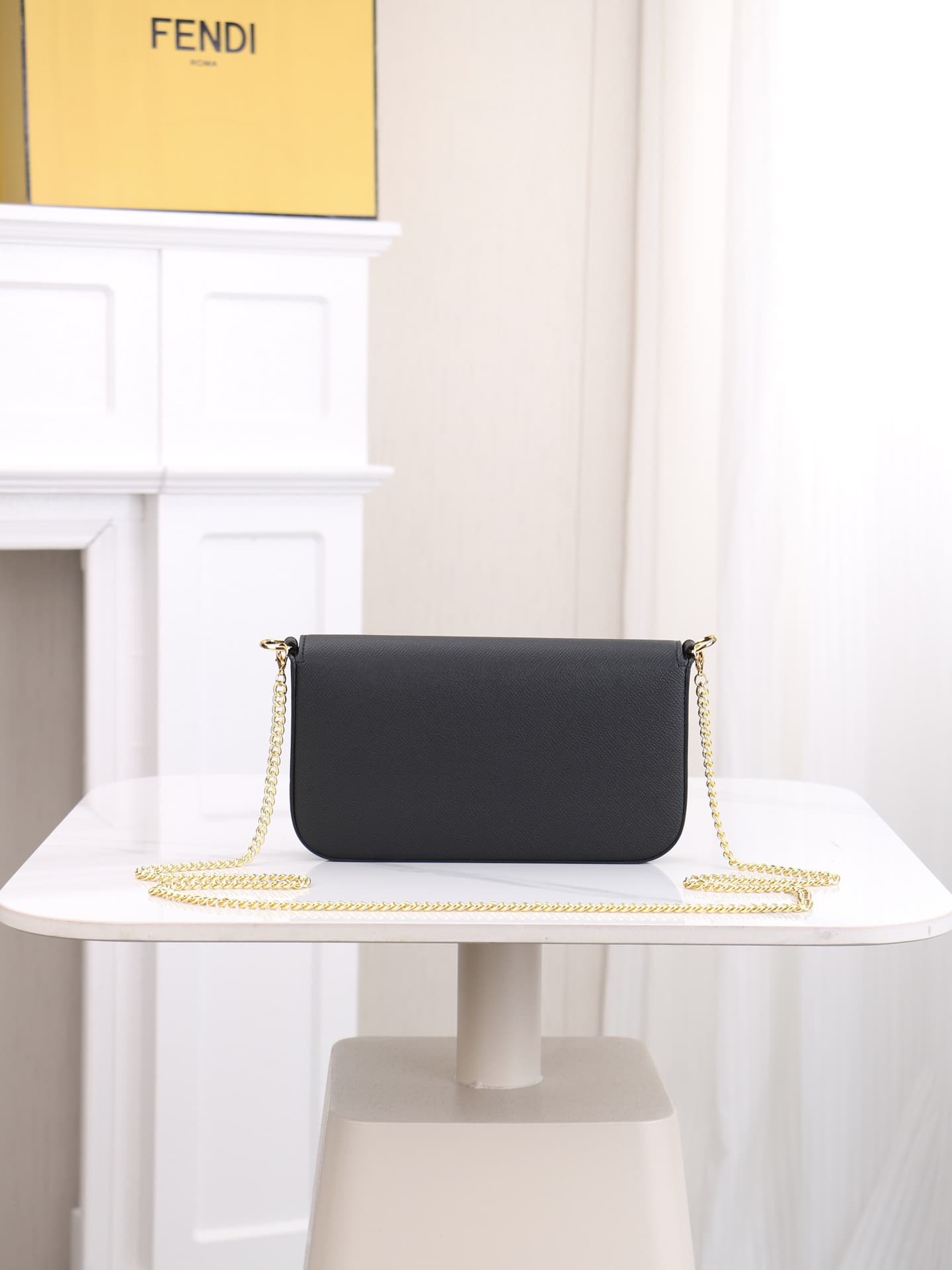 C2869 Fendi mini handbag with geometric pattern flap, equipped with a zipper closure.可拆卸 chain strap. Interior has flat pockets. The bag’s exterior is made of iconic brown leather with black raised FF print; it includes two detachable inner pockets – one  — image 3