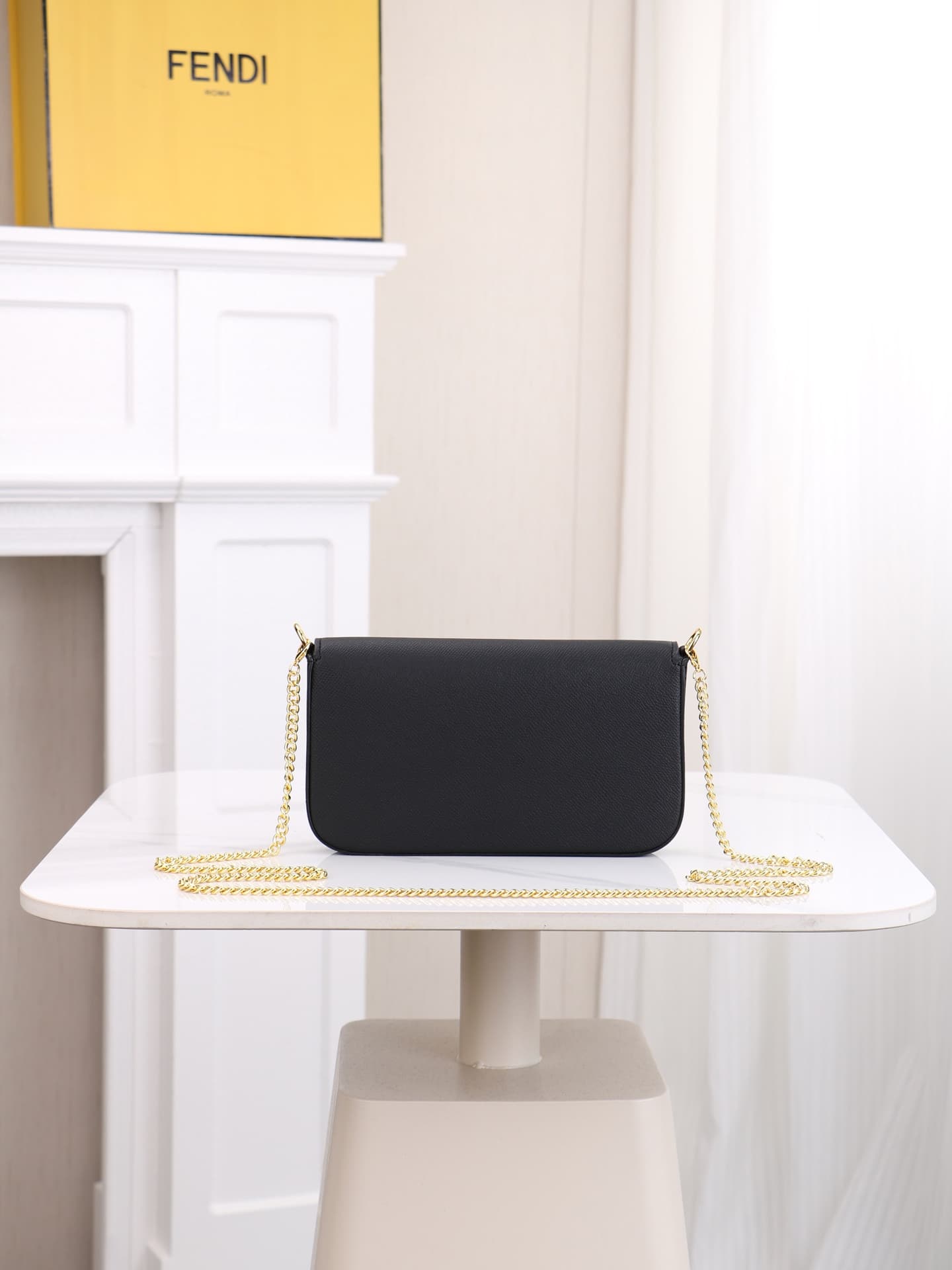 C2868 Fendi mini handbag with geometric pattern snap closures, detachable chain shoulder strap. Inner lining features flat pockets. The bag is made of iconic brown leather with black raised FF print; it comes with two detachable inner pockets – one made o — image 3