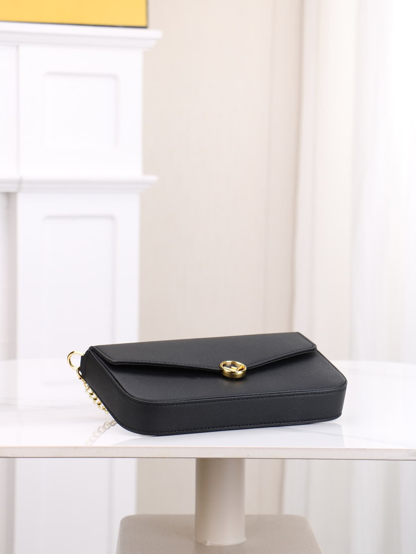 C2868 Fendi mini handbag with geometric pattern snap closures, detachable chain shoulder strap. Inner lining features flat pockets. The bag is made of iconic brown leather with black raised FF print; it comes with two detachable inner pockets – one made o — image 4