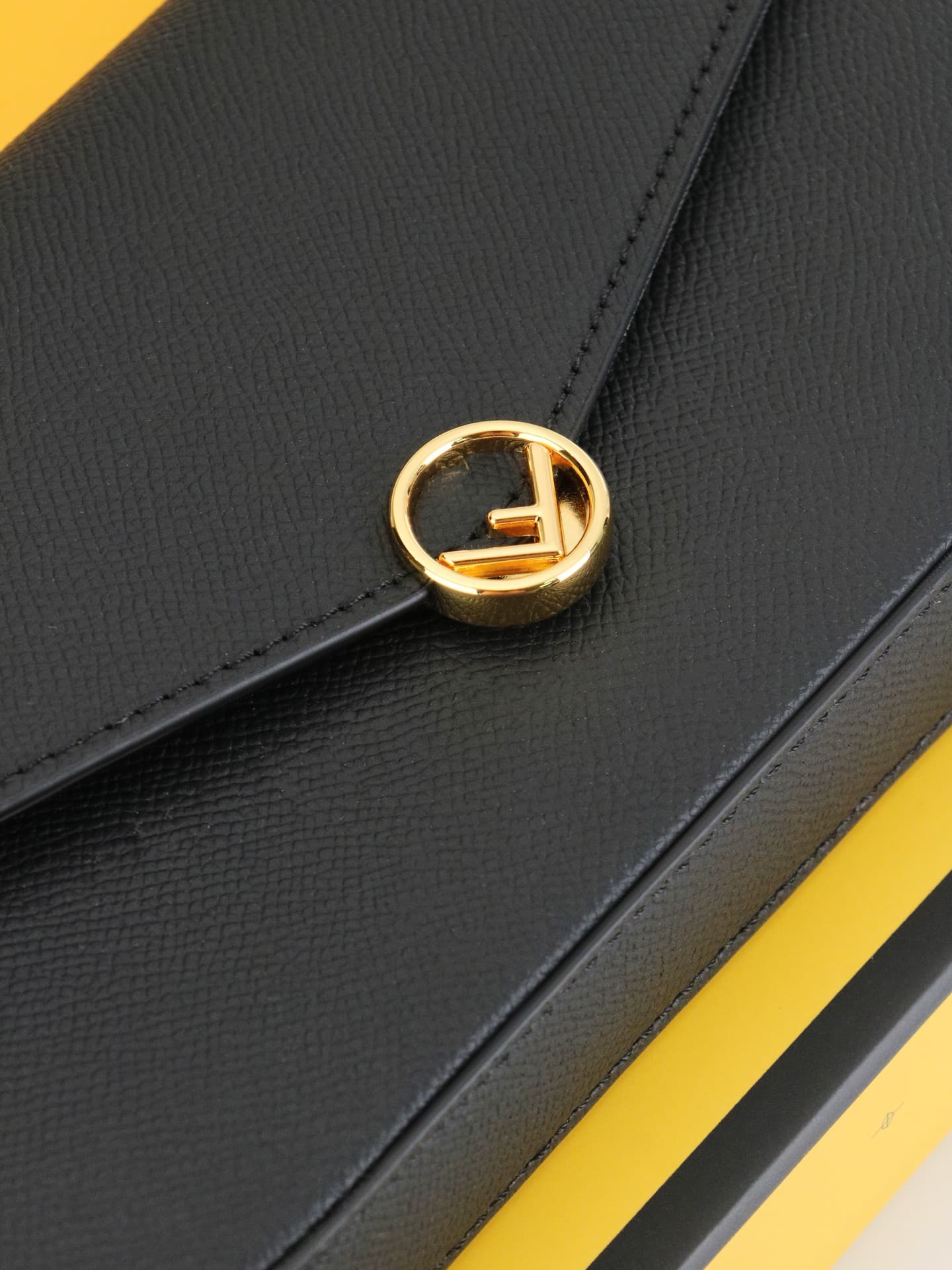 C2868 Fendi mini handbag with geometric pattern snap closures, detachable chain shoulder strap. Inner lining features flat pockets. The bag is made of iconic brown leather with black raised FF print; it comes with two detachable inner pockets – one made o — image 5