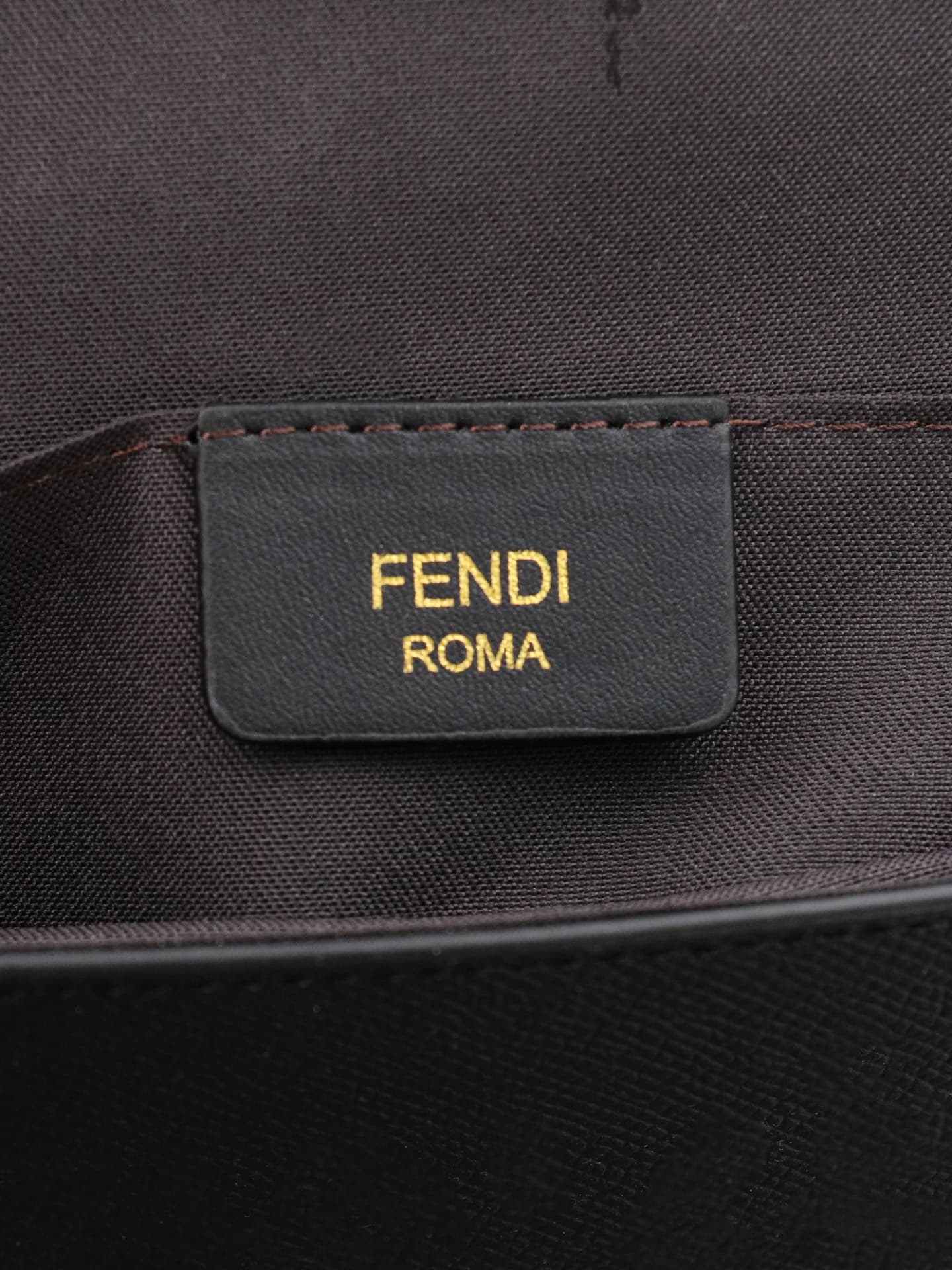 C2868 Fendi mini handbag with geometric pattern snap closures, detachable chain shoulder strap. Inner lining features flat pockets. The bag is made of iconic brown leather with black raised FF print; it comes with two detachable inner pockets – one made o — image 8