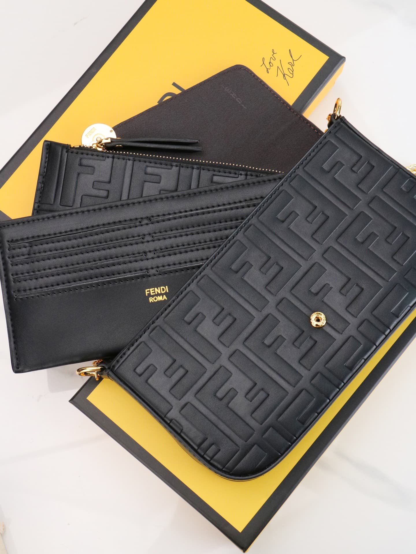 C2867 Fendi mini handbag with geometric pattern snap closure, featuring a detachable chain strap. It has a flat pocket inside. The bag is made of iconic brown leather with black raised FF patterns; it comes with two detachable inner pockets – one made of  — image 6