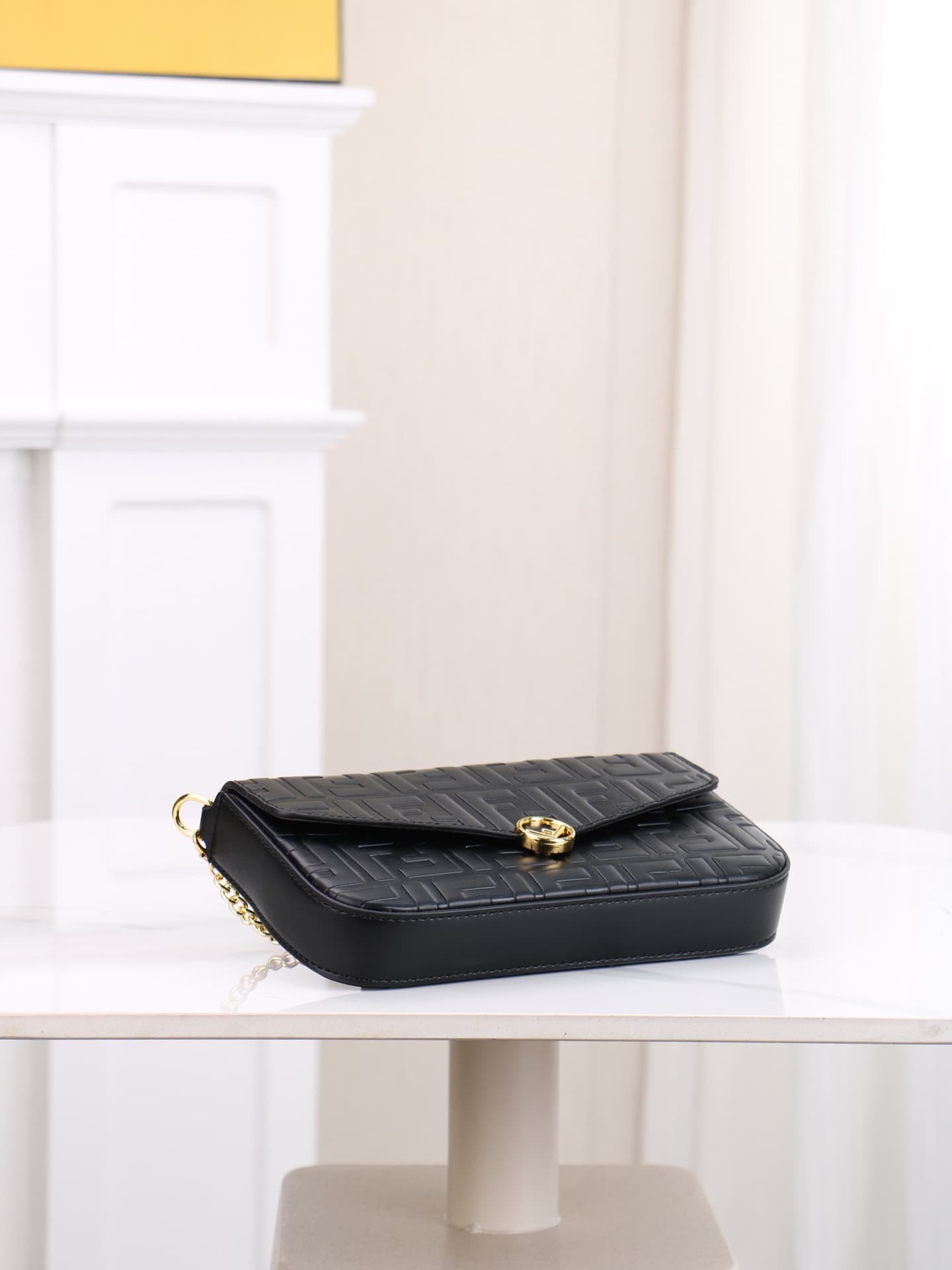 C2867 Fendi mini handbag with geometric pattern snap closure, featuring a detachable chain strap. It has a flat pocket inside. The bag is made of iconic brown leather with black raised FF patterns; it comes with two detachable inner pockets – one made of  — image 4