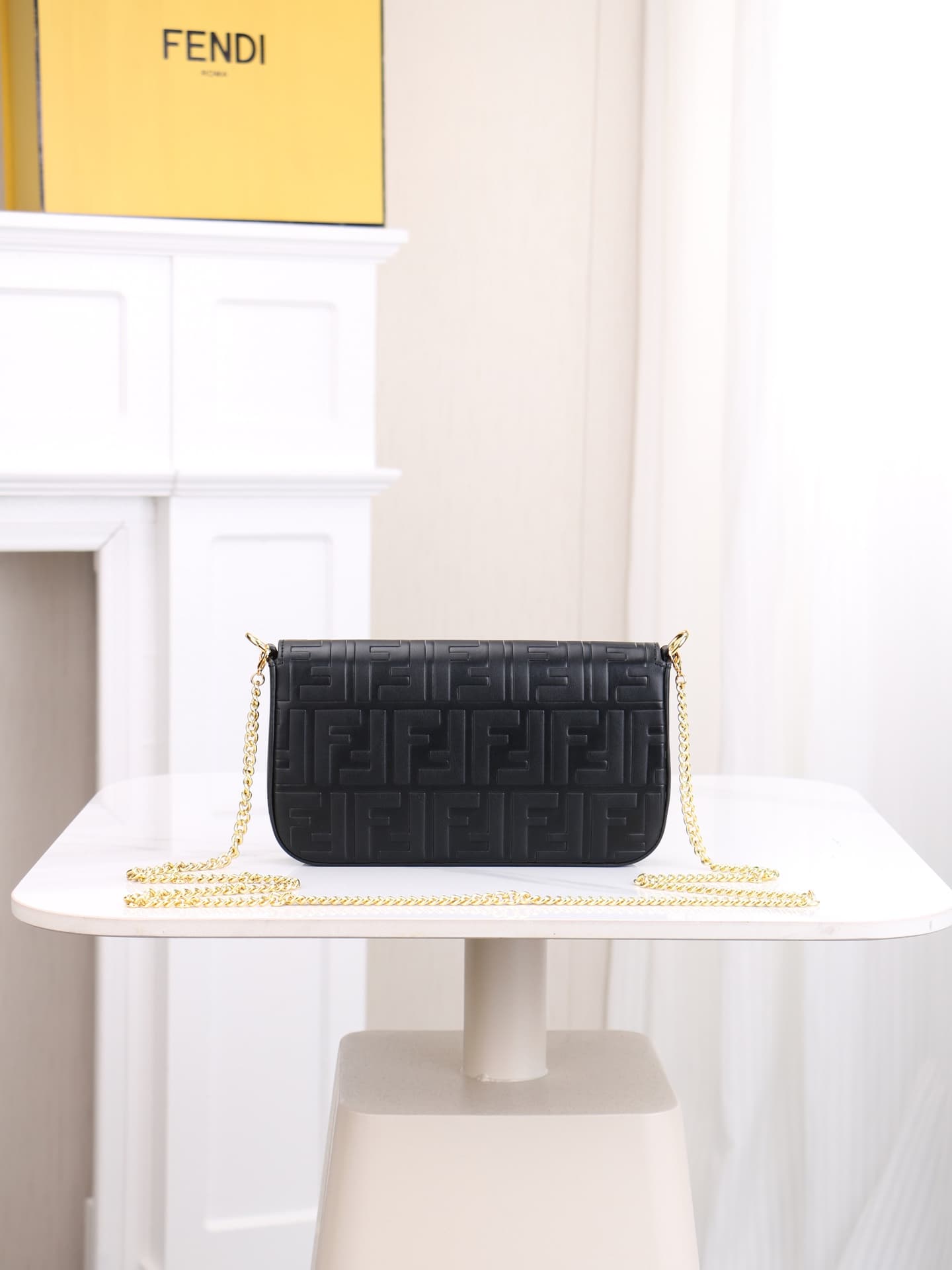 C2867 Fendi mini handbag with geometric pattern snap closure, featuring a detachable chain strap. It has a flat pocket inside. The bag is made of iconic brown leather with black raised FF patterns; it comes with two detachable inner pockets – one made of  — image 3