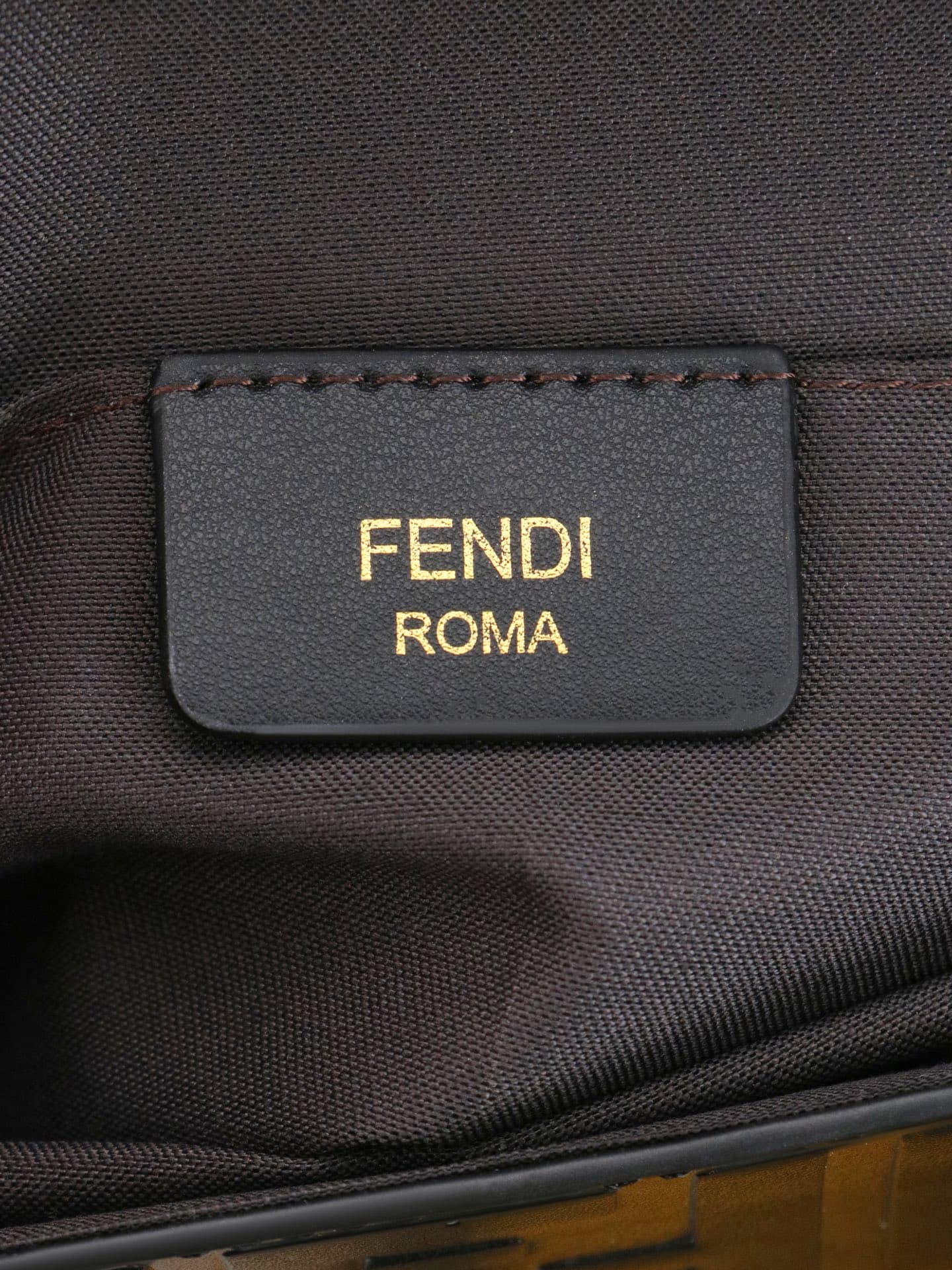 C2867 Fendi mini handbag with geometric pattern snap closure, featuring a detachable chain strap. It has a flat pocket inside. The bag is made of iconic brown leather with black raised FF patterns; it comes with two detachable inner pockets – one made of  — image 8