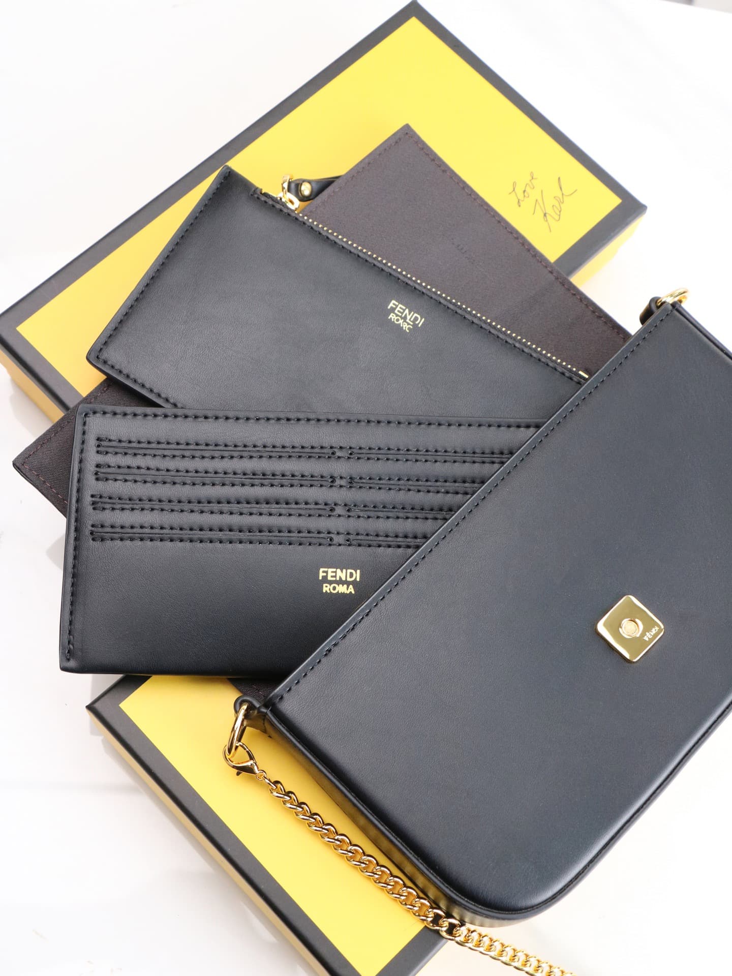 C2864 Fendi mini handbag with geometric pattern flap, equipped with zipper closure. Removable chain shoulder strap. Inner lining features flat pockets. The bag’s exterior is made of iconic brown leather with black raised FF print patterns. It includes two — image 7