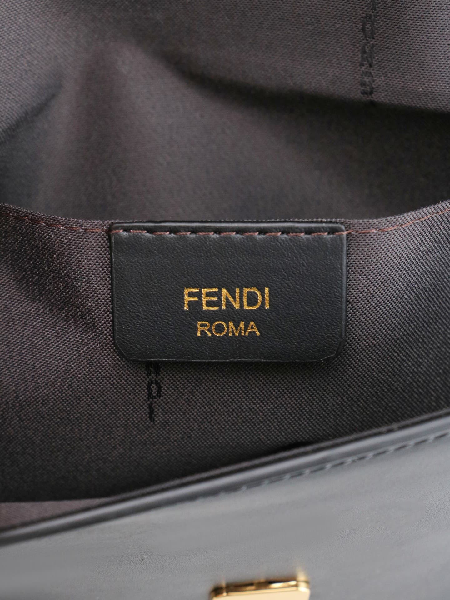 C2864 Fendi mini handbag with geometric pattern flap, equipped with zipper closure. Removable chain shoulder strap. Inner lining features flat pockets. The bag’s exterior is made of iconic brown leather with black raised FF print patterns. It includes two — image 8