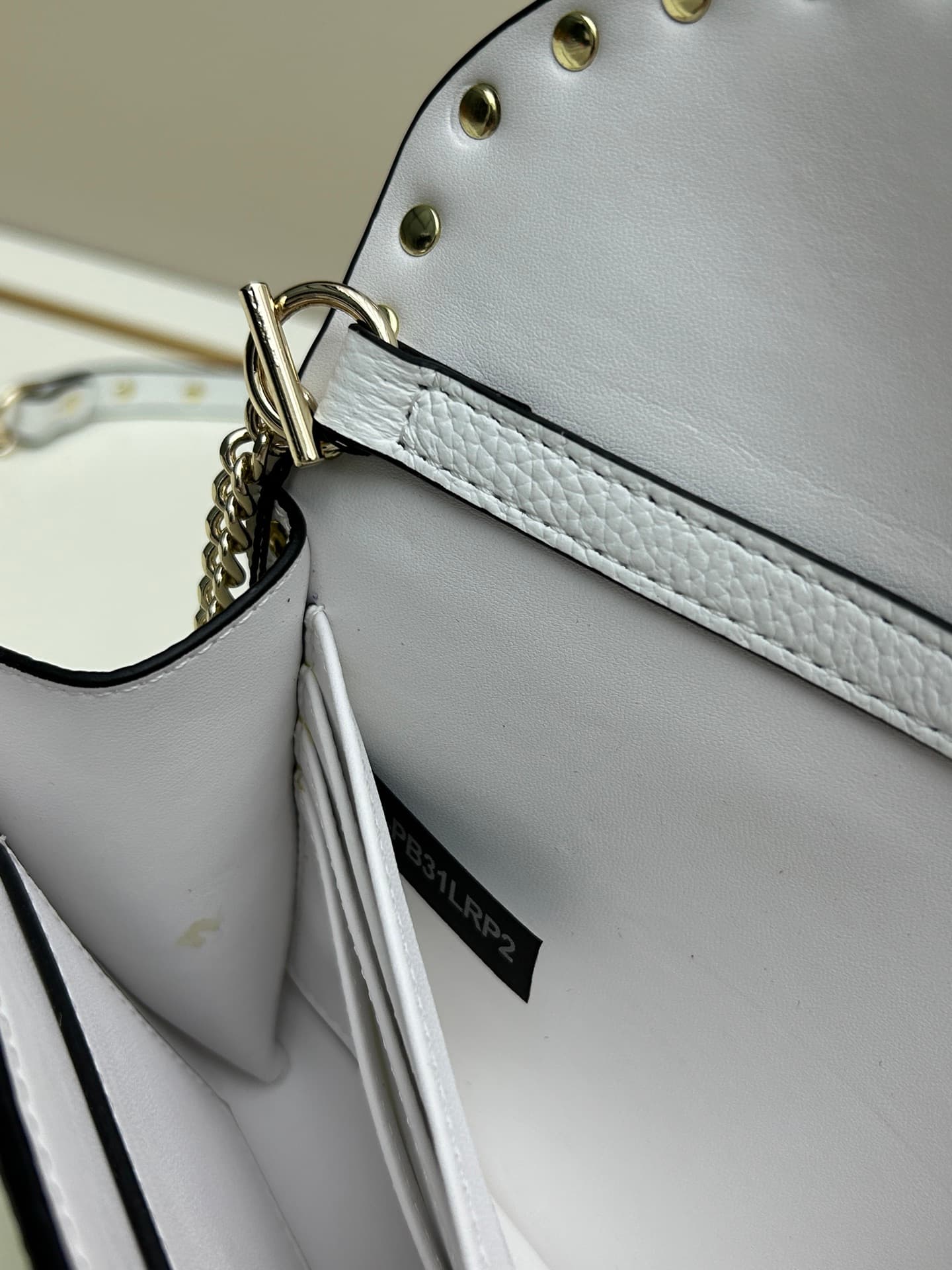 C8296 Garavani Rockstud Mini leather crossbody bag, featuring the iconic hook closure design — image 8