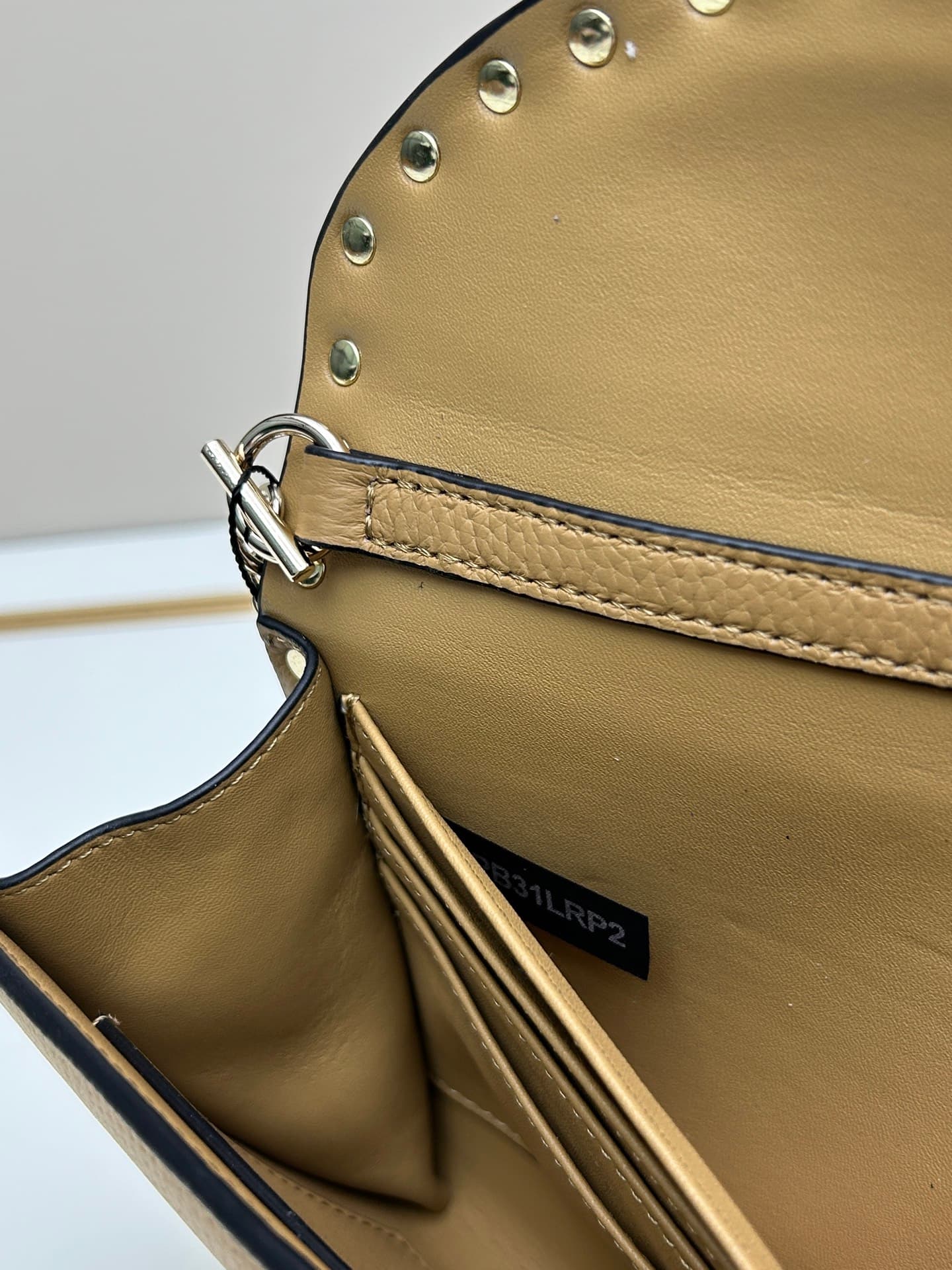 C8295 Garavani Rockstud Mini leather crossbody bag, featuring the iconic hook closure design — image 8