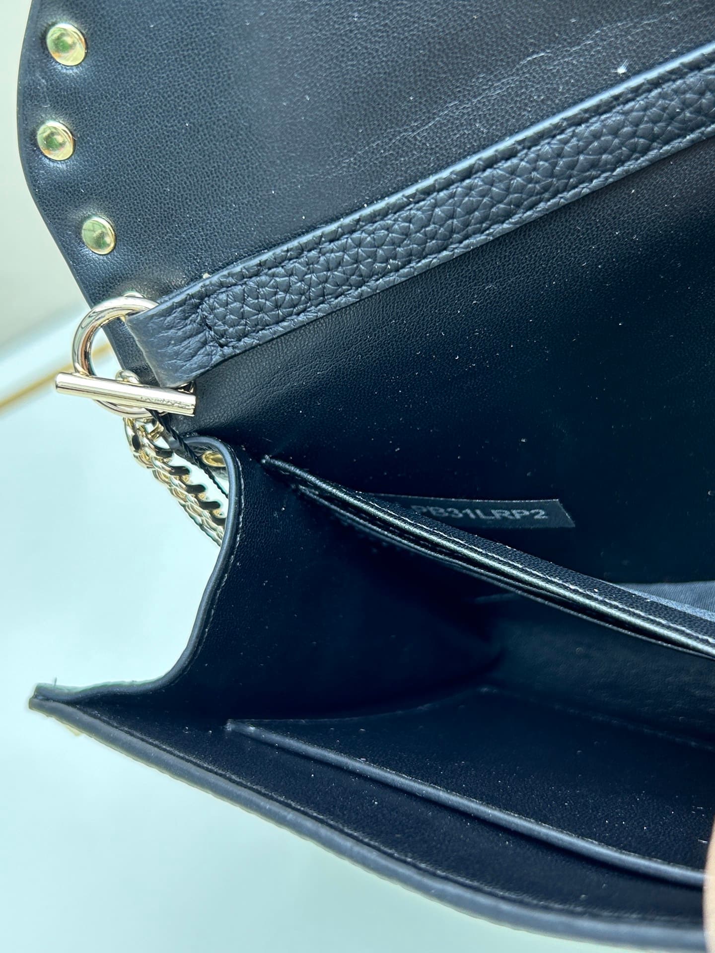 C8294 Garavani Rockstud Mini cowhide crossbody bag, featuring the iconic hook-clasp closure design — image 8