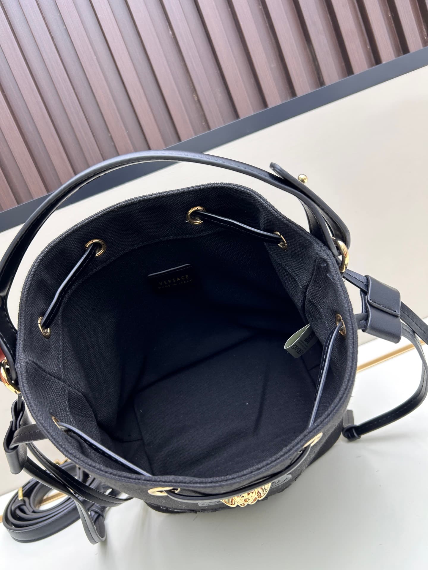 C8387 . New model 🆕 available for sale: Versace women’s straped bucket bag. High-quality material, large capacity – it really holds a lot of things. It comes with long and short shoulder straps — image 7