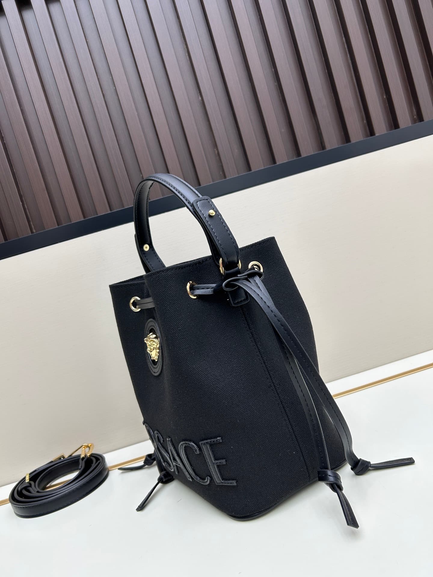 C8387 . New model 🆕 available for sale: Versace women’s straped bucket bag. High-quality material, large capacity – it really holds a lot of things. It comes with long and short shoulder straps — image 2