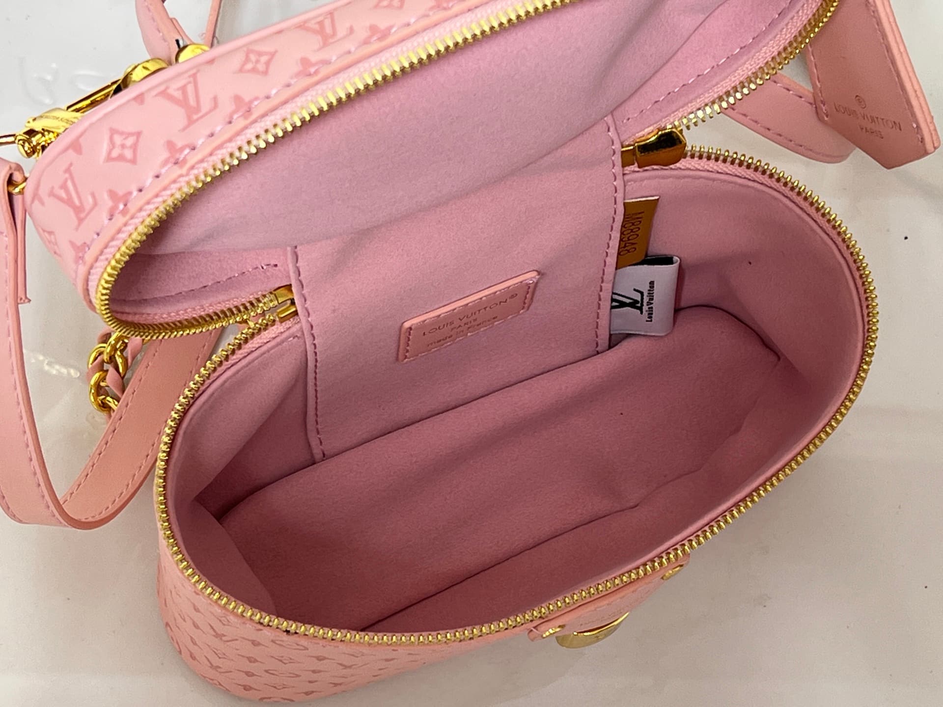 C5167 💰M29166 M47125 Brown with small dots, Pink with small dots, Yellow with small dots. This Vanity Chain Pouch handbag comes from the LVSki collection, which has a traditional makeup bag style. — image 8