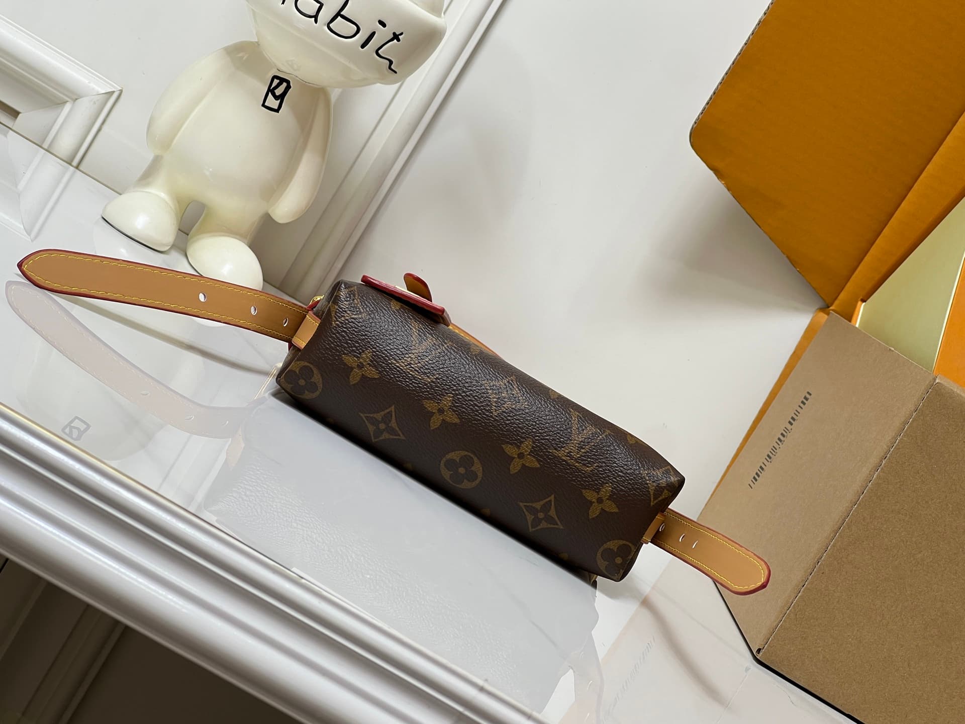 C5077 💰M2A711 Patterned design. This Nano CarryAll handbag brings a fresh touch of classic style to everyday use. The monogram pattern is presented on canvas, with contrasting leather trim at the straps; the details are elegant, and the name tag features  — image 7