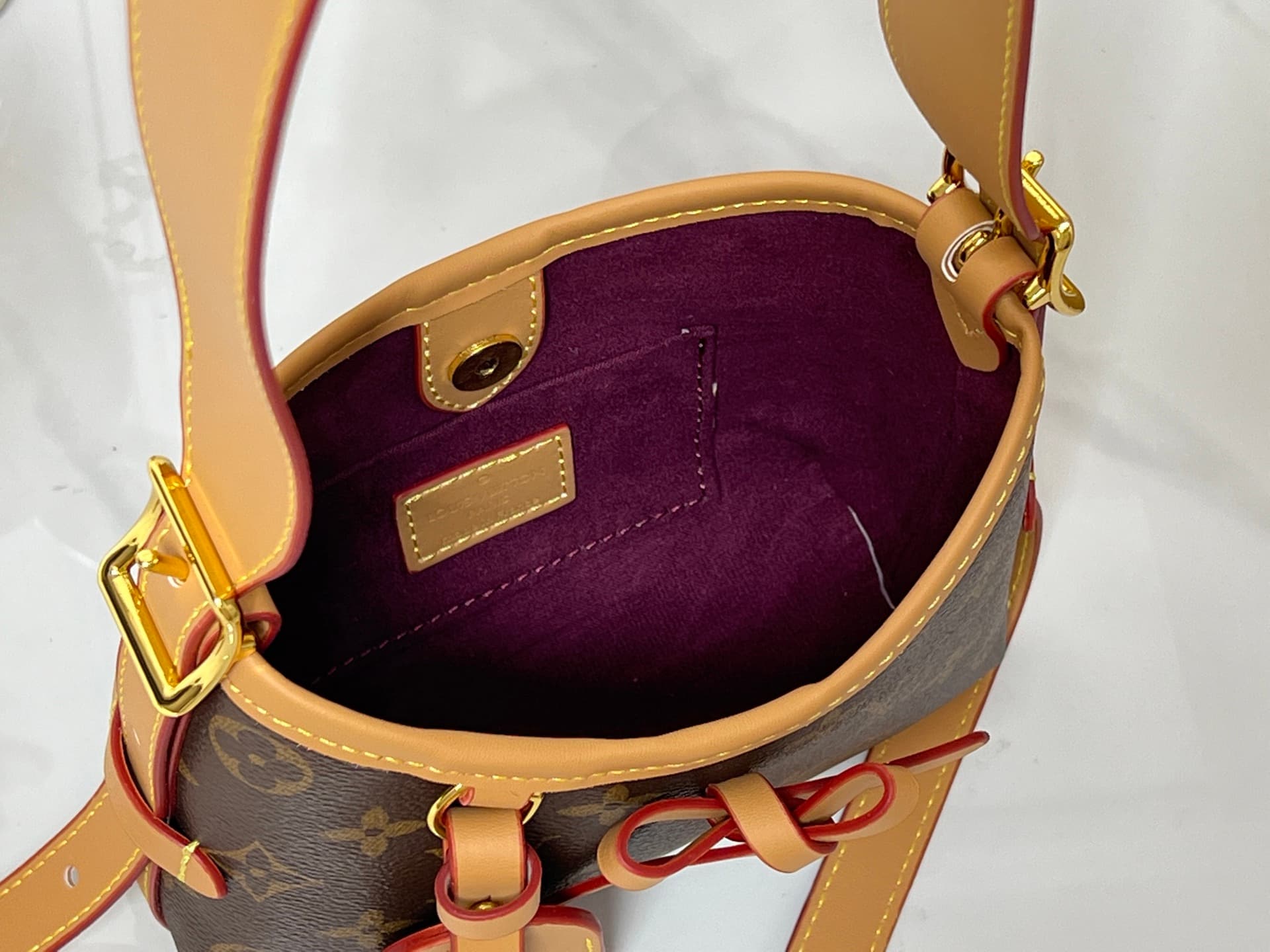 C5077 💰M2A711 Patterned design. This Nano CarryAll handbag brings a fresh touch of classic style to everyday use. The monogram pattern is presented on canvas, with contrasting leather trim at the straps; the details are elegant, and the name tag features  — image 8