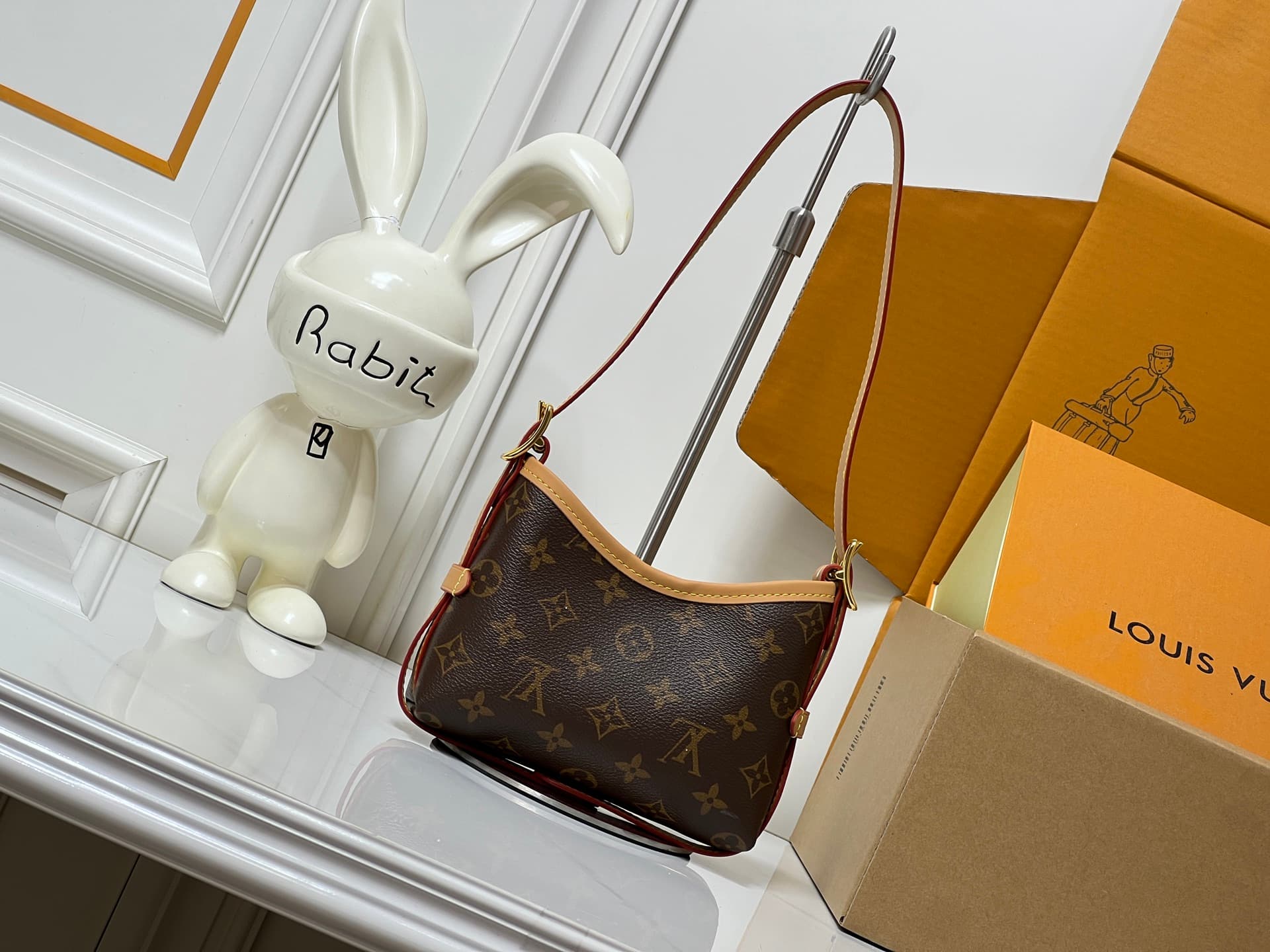 C5077 💰M2A711 Patterned design. This Nano CarryAll handbag brings a fresh touch of classic style to everyday use. The monogram pattern is presented on canvas, with contrasting leather trim at the straps; the details are elegant, and the name tag features  — image 5
