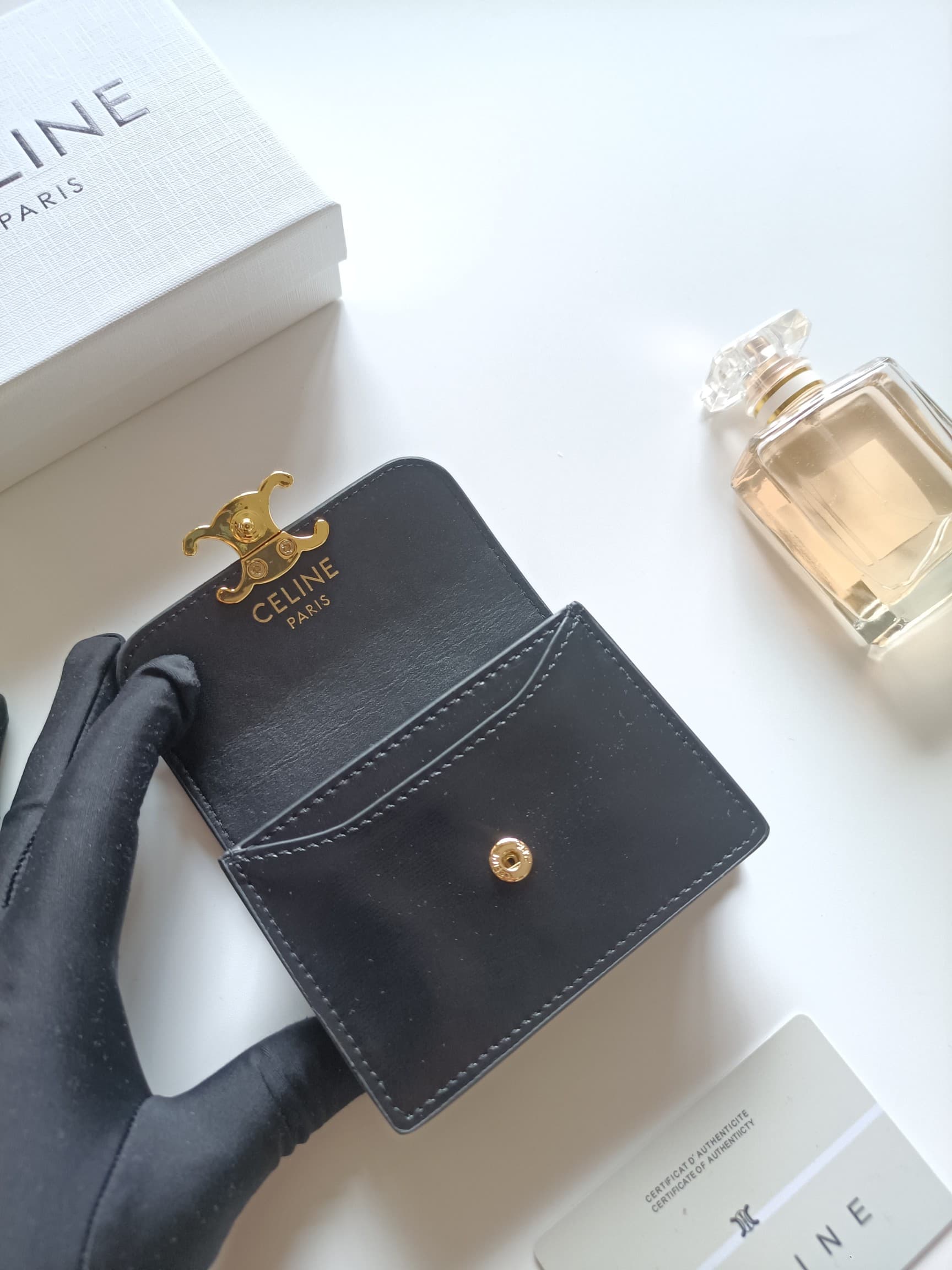 C458 Celine’s new card bag, TRIOMPHE namecard bag. It features a classic pattern on the large interior surface, with flat-texted microfiber material. The bag has a golden metallic zipper closure. It includes one thick inner compartment and one card slot o — image 5