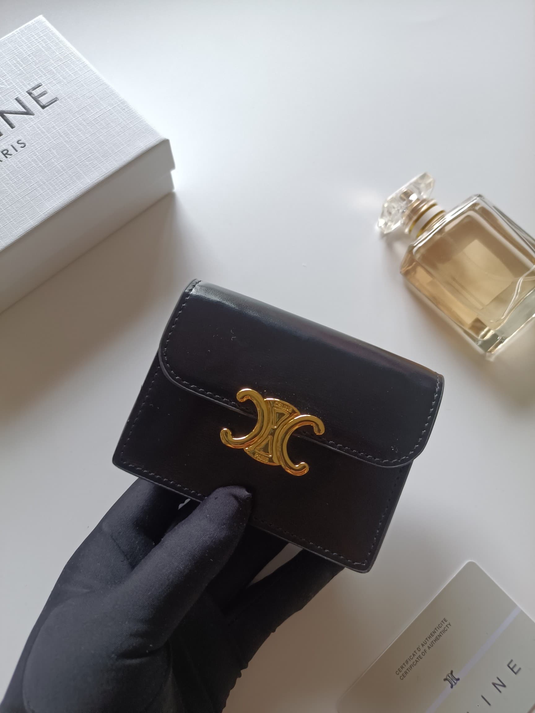 C458 Celine’s new card bag, TRIOMPHE namecard bag. It features a classic pattern on the large interior surface, with flat-texted microfiber material. The bag has a golden metallic zipper closure. It includes one thick inner compartment and one card slot o — image 4