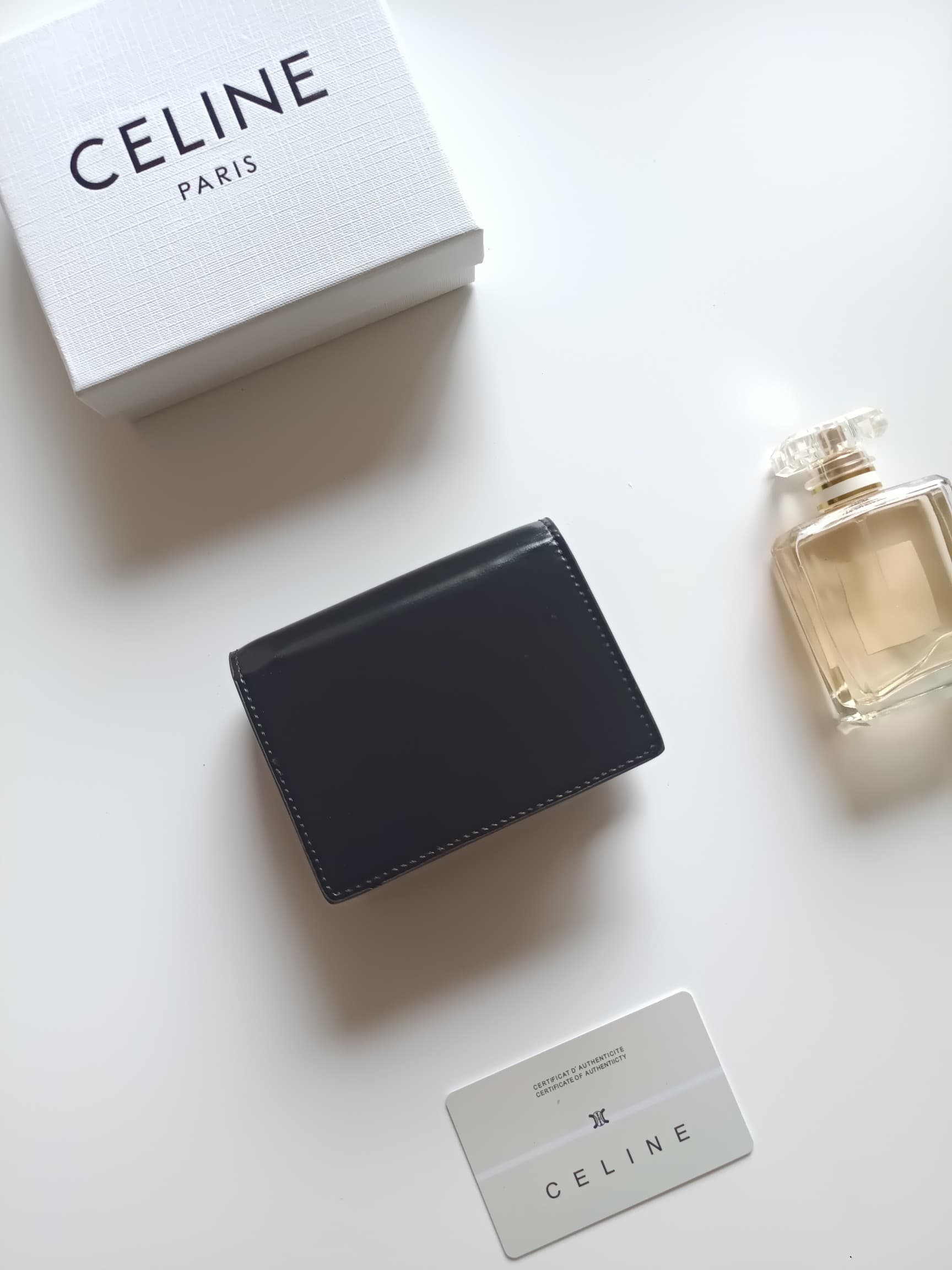 C458 Celine’s new card bag, TRIOMPHE namecard bag. It features a classic pattern on the large interior surface, with flat-texted microfiber material. The bag has a golden metallic zipper closure. It includes one thick inner compartment and one card slot o — image 3
