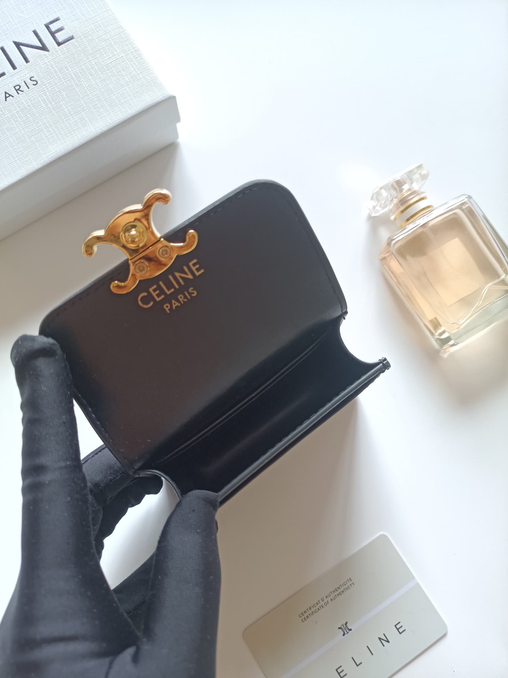 C458 Celine’s new card bag, TRIOMPHE namecard bag. It features a classic pattern on the large interior surface, with flat-texted microfiber material. The bag has a golden metallic zipper closure. It includes one thick inner compartment and one card slot o — image 6
