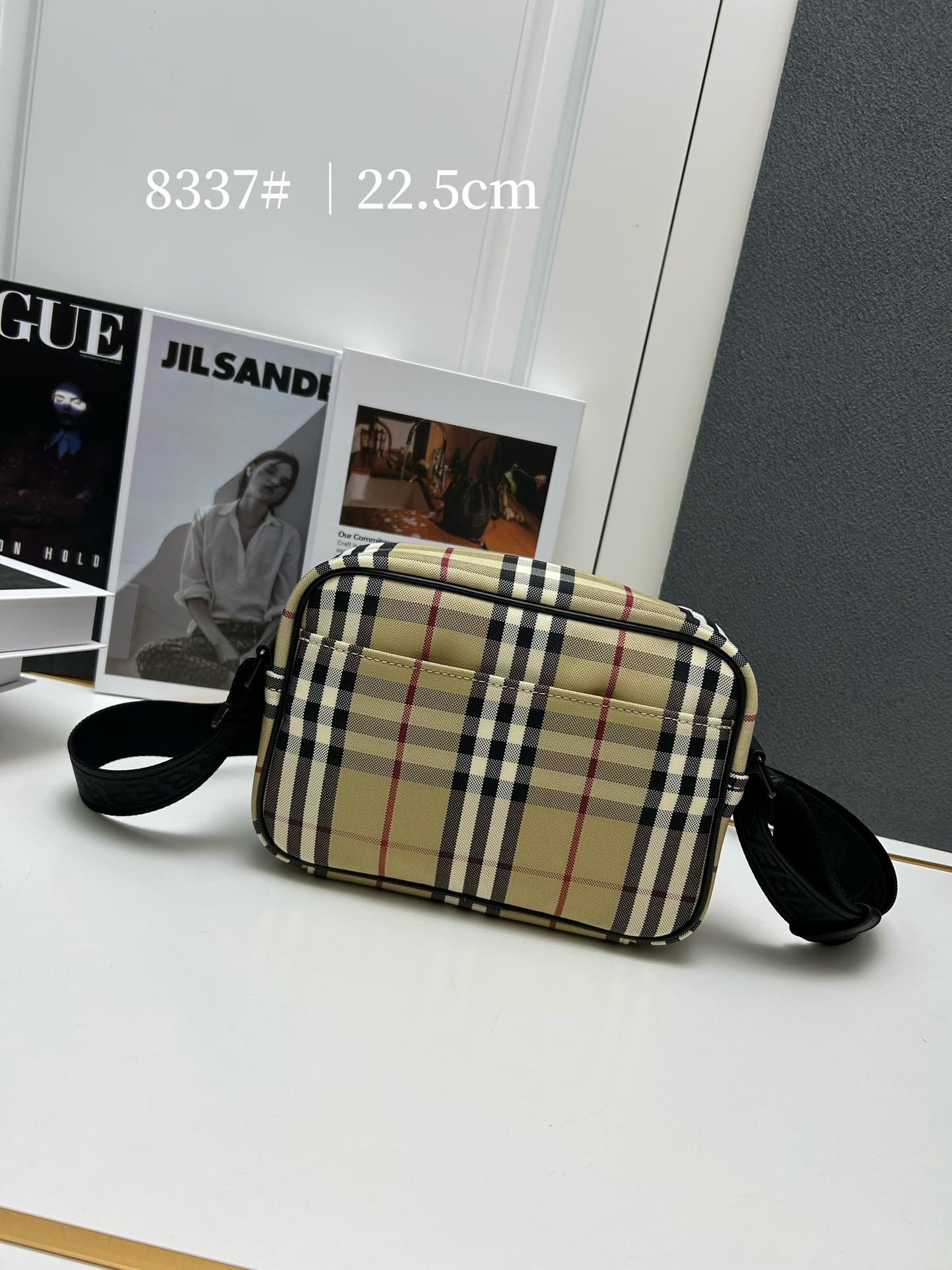 C34 [Brand B] 200: A vibrant decorative bag with a plaid pattern in the “Bur” style. It features a belt with a brand logo embroidery. Adjustable diagonal shoulder strap; a zipper pocket on the outside; a external pocket on 1 that opens using magnetic fast — image 3