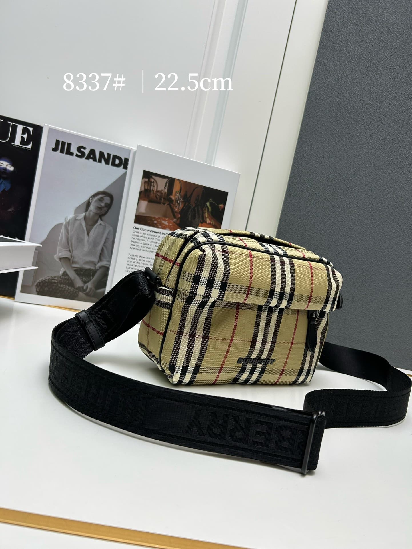 C34 [Brand B] 200: A vibrant decorative bag with a plaid pattern in the “Bur” style. It features a belt with a brand logo embroidery. Adjustable diagonal shoulder strap; a zipper pocket on the outside; a external pocket on 1 that opens using magnetic fast — image 2