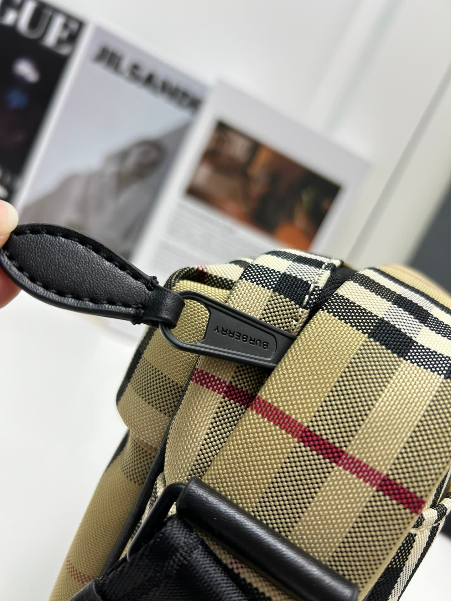 C34 [Brand B] 200: A vibrant decorative bag with a plaid pattern in the “Bur” style. It features a belt with a brand logo embroidery. Adjustable diagonal shoulder strap; a zipper pocket on the outside; a external pocket on 1 that opens using magnetic fast — image 7