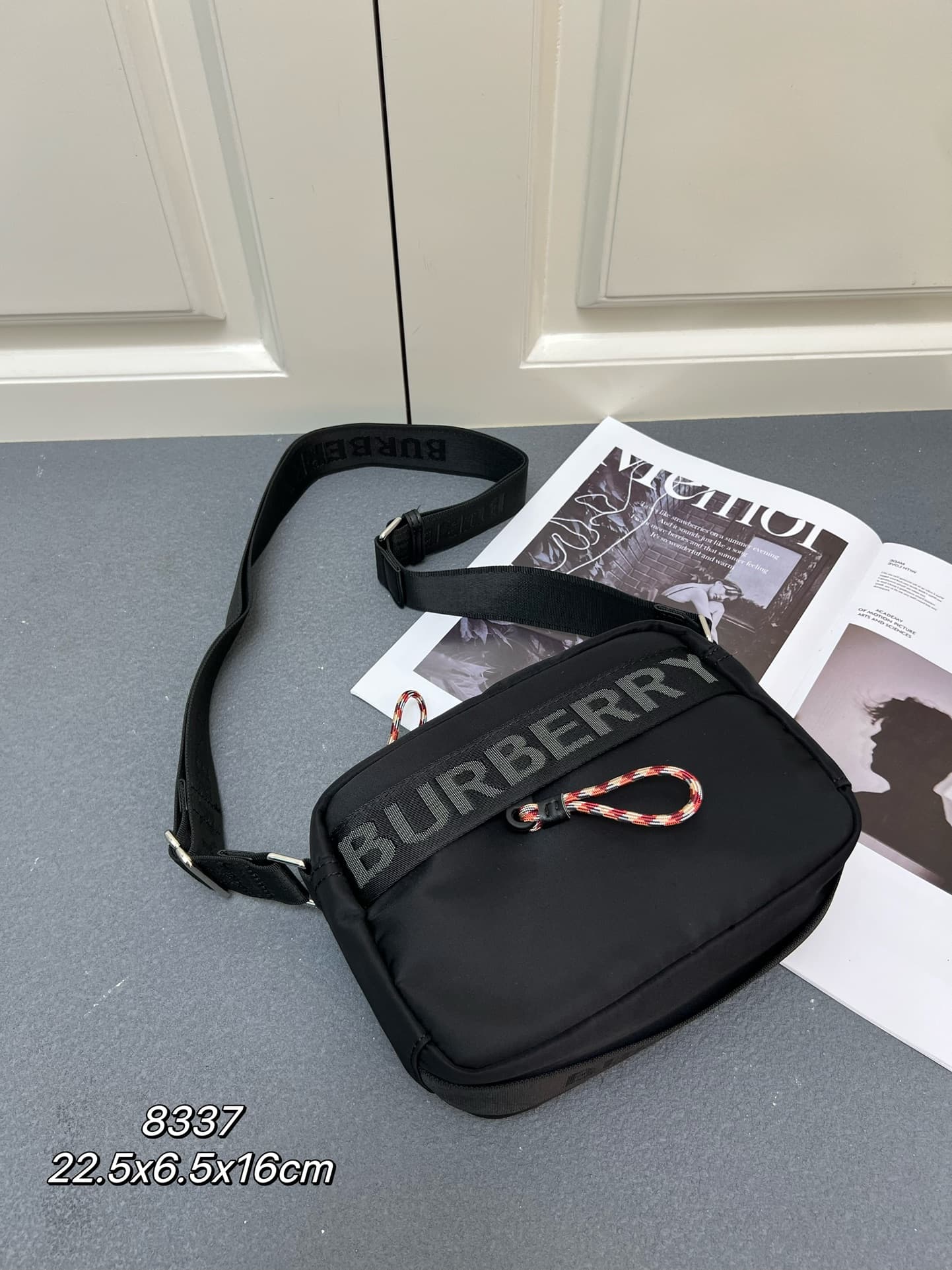 C37 [Brand B] 200: A vibrant decorative bag with a checked pattern in the “Paddy” style, featuring a brand logo embroidered on the strap. Adjustable diagonal shoulder strap; a zipper pocket; a magnetic closure external pocket. The zipper closure is also a — image 1