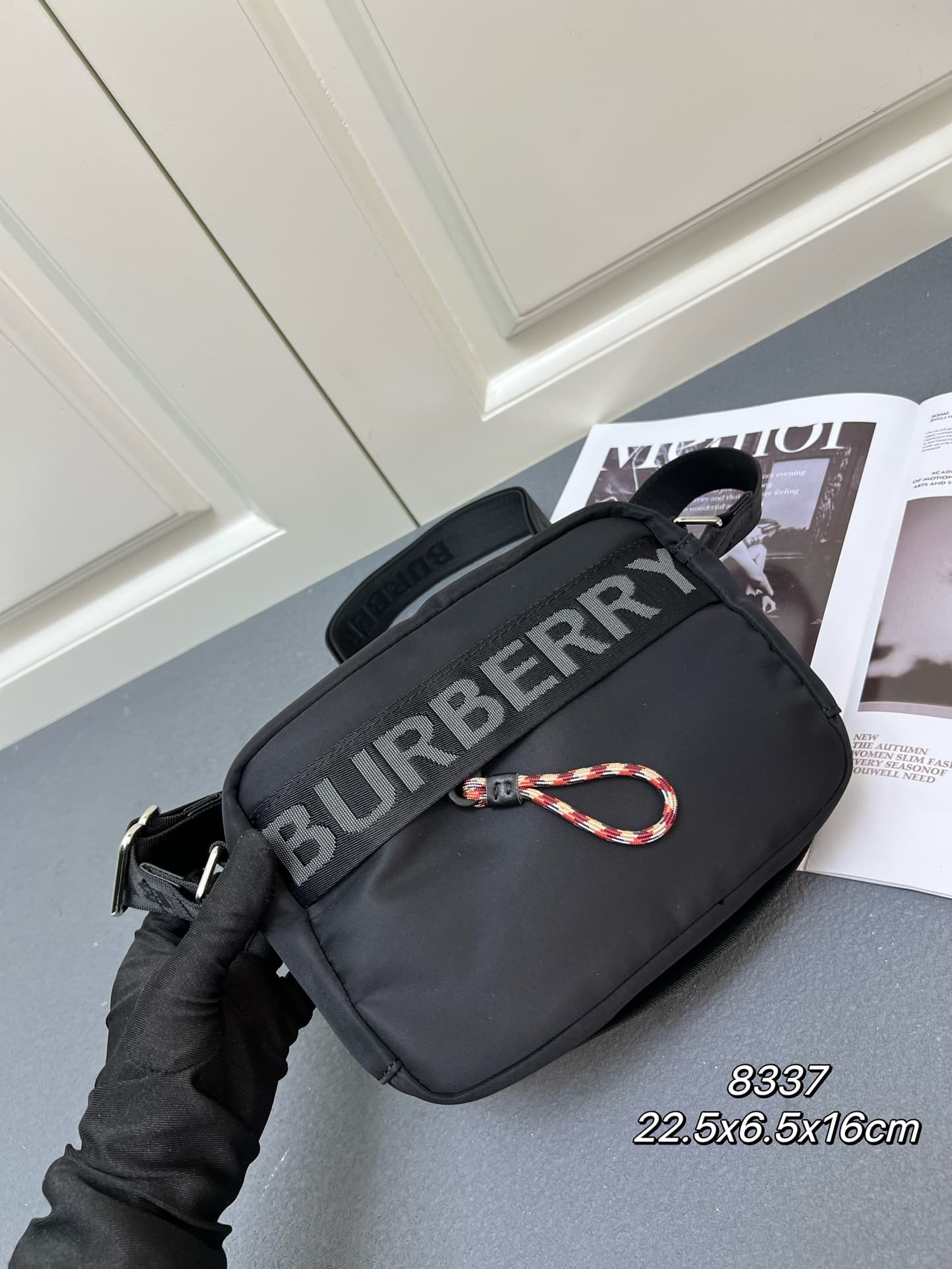 C37 [Brand B] 200: A vibrant decorative bag with a checked pattern in the “Paddy” style, featuring a brand logo embroidered on the strap. Adjustable diagonal shoulder strap; a zipper pocket; a magnetic closure external pocket. The zipper closure is also a — image 2