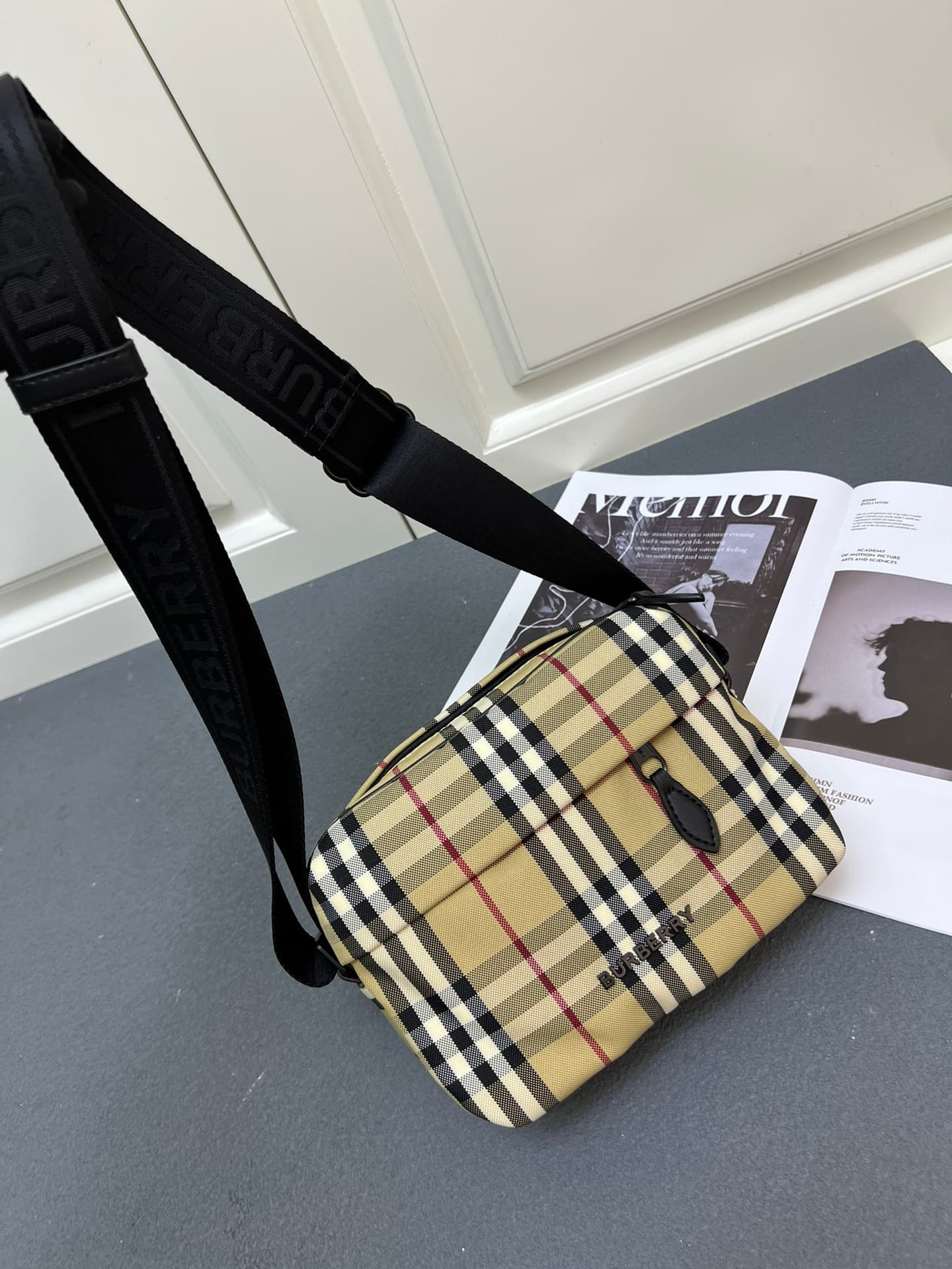 C35 [Brand B] 200: A vibrant decorative bag with a plaid pattern in the “Bur” style. It features a zipper strap adorned with the brand logo. There is an adjustable diagonal strap, a zipper pocket, and an external pocket that opens via magnetic closures or — image 5