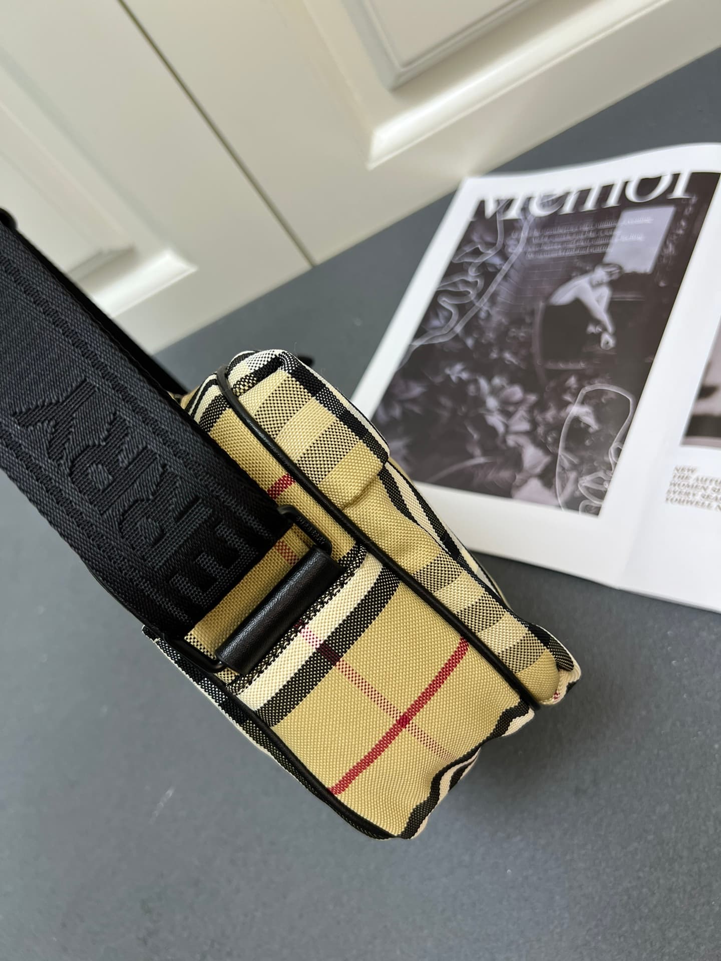 C35 [Brand B] 200: A vibrant decorative bag with a plaid pattern in the “Bur” style. It features a zipper strap adorned with the brand logo. There is an adjustable diagonal strap, a zipper pocket, and an external pocket that opens via magnetic closures or — image 4