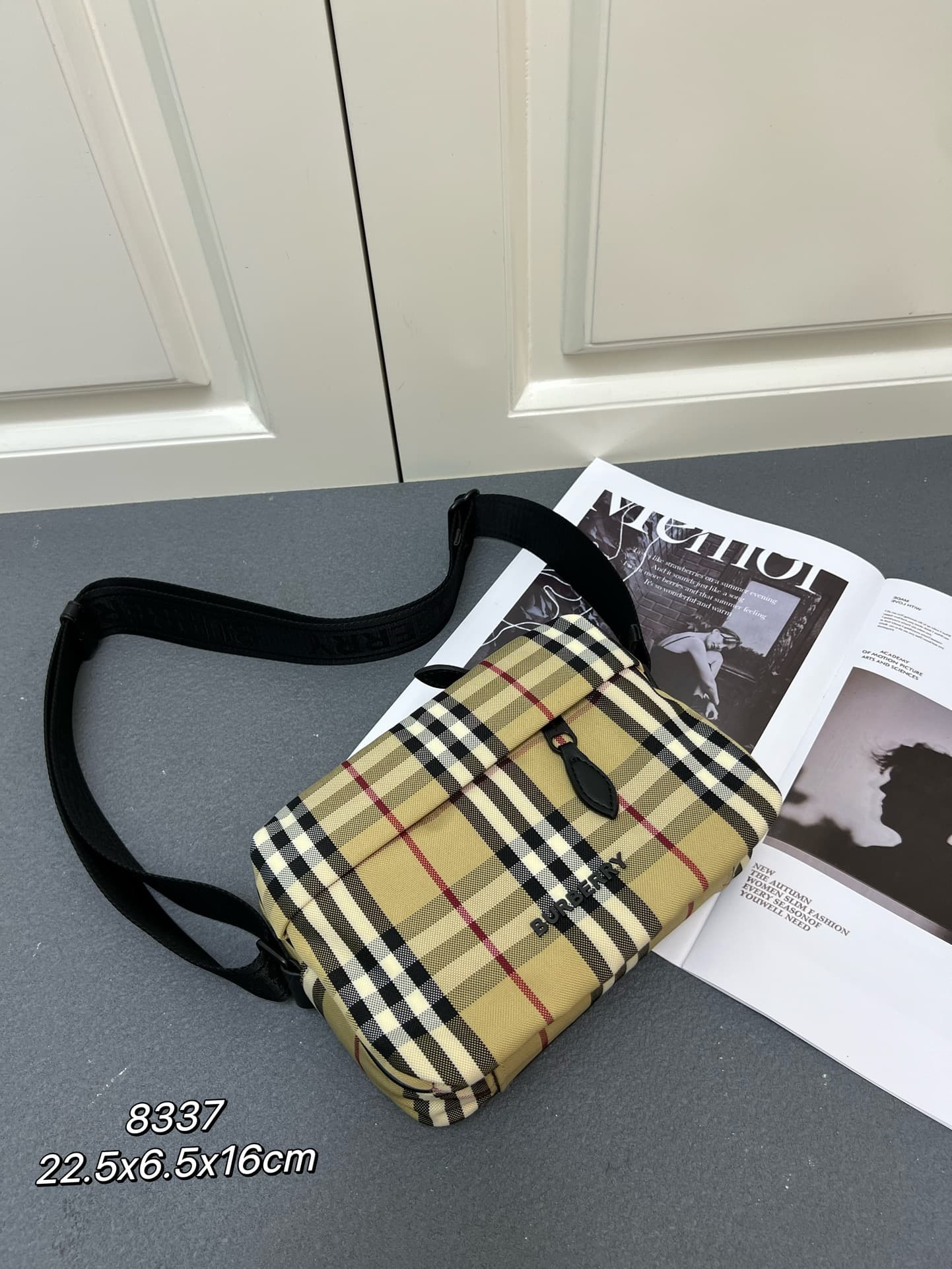 C35 [Brand B] 200: A vibrant decorative bag with a plaid pattern in the “Bur” style. It features a zipper strap adorned with the brand logo. There is an adjustable diagonal strap, a zipper pocket, and an external pocket that opens via magnetic closures or — image 1
