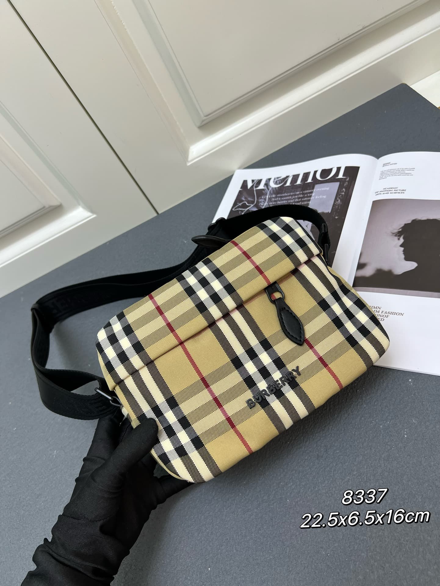 C35 [Brand B] 200: A vibrant decorative bag with a plaid pattern in the “Bur” style. It features a zipper strap adorned with the brand logo. There is an adjustable diagonal strap, a zipper pocket, and an external pocket that opens via magnetic closures or — image 2