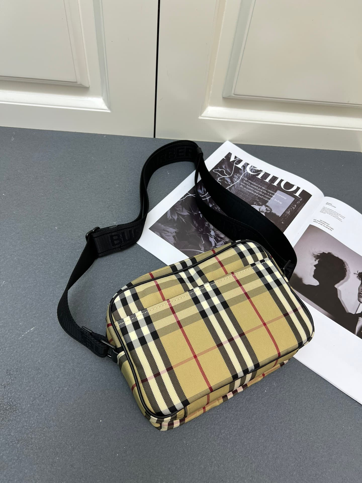 C35 [Brand B] 200: A vibrant decorative bag with a plaid pattern in the “Bur” style. It features a zipper strap adorned with the brand logo. There is an adjustable diagonal strap, a zipper pocket, and an external pocket that opens via magnetic closures or — image 3