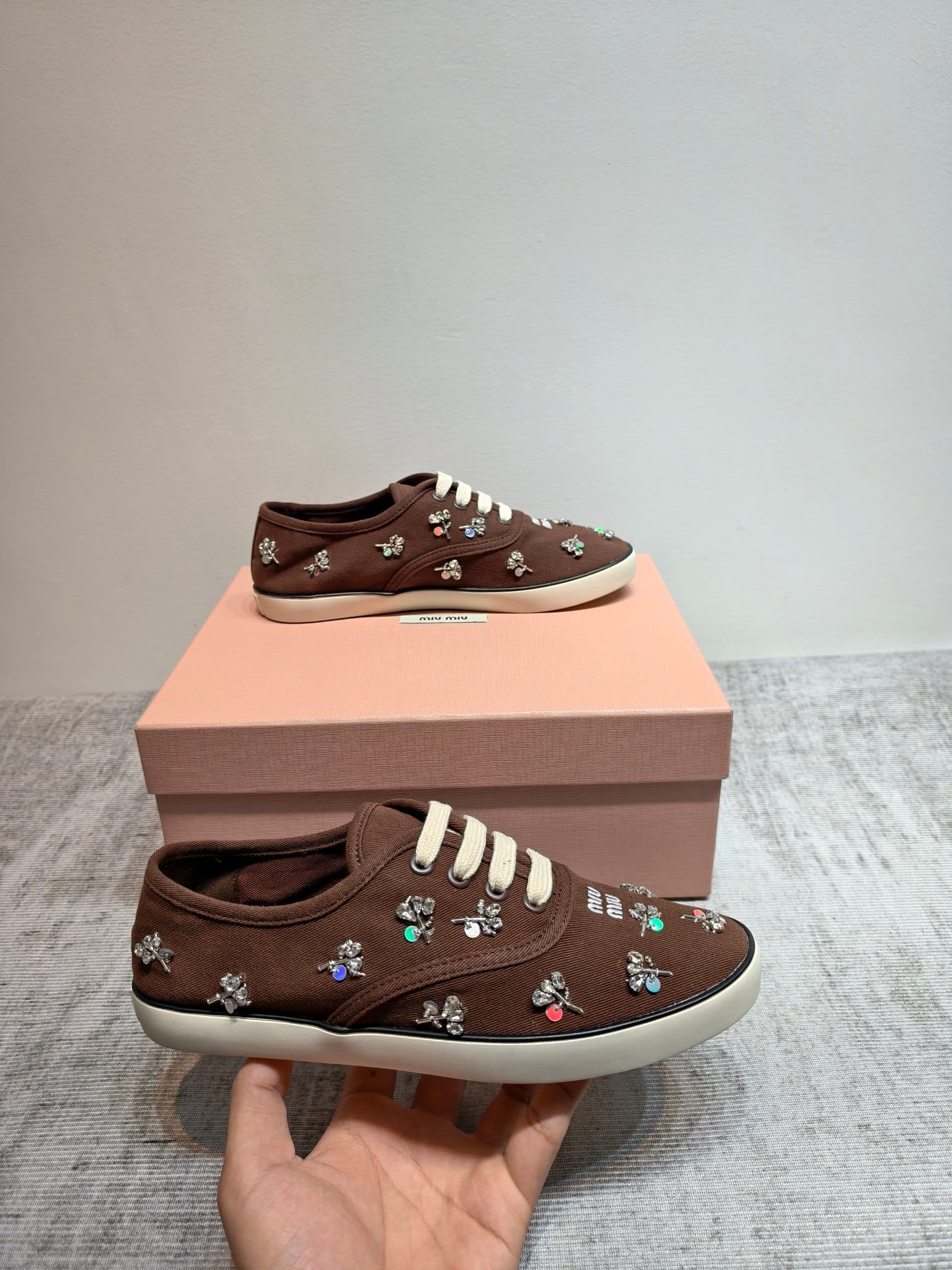 D10642 MIUMIU 2026 new model. The upper is made of twill canvas (textile material) with a textile lining. The sole is made of rubber with the brand logo. The insole is a detachable fabric insole, offering both comfort and a distinct brand feel. Iconic “pe — image 2